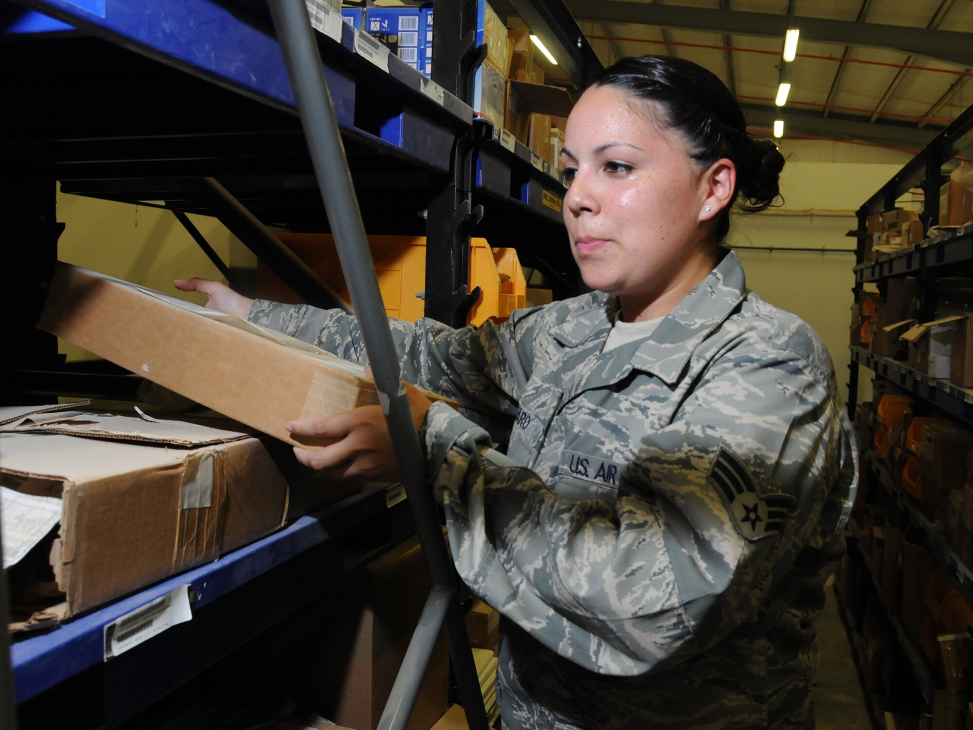 Senior Airman Debbie Alfaro, 379th Expeditionary Logistics Readiness Squadron storage and issue technician, prepares a supply order here, Sept. 23. The 379 ELRS storage and issue facility stores and issues more than 5,000 line items to support back shops and non-flying organizations on base. Airman Alfaro is deployed from Little Rock Air Force Base, Ark. in support of Operations Iraqi and Enduring Freedom. (U.S. Air Force Photo/Tech. Sgt. Jason W. Edwards)