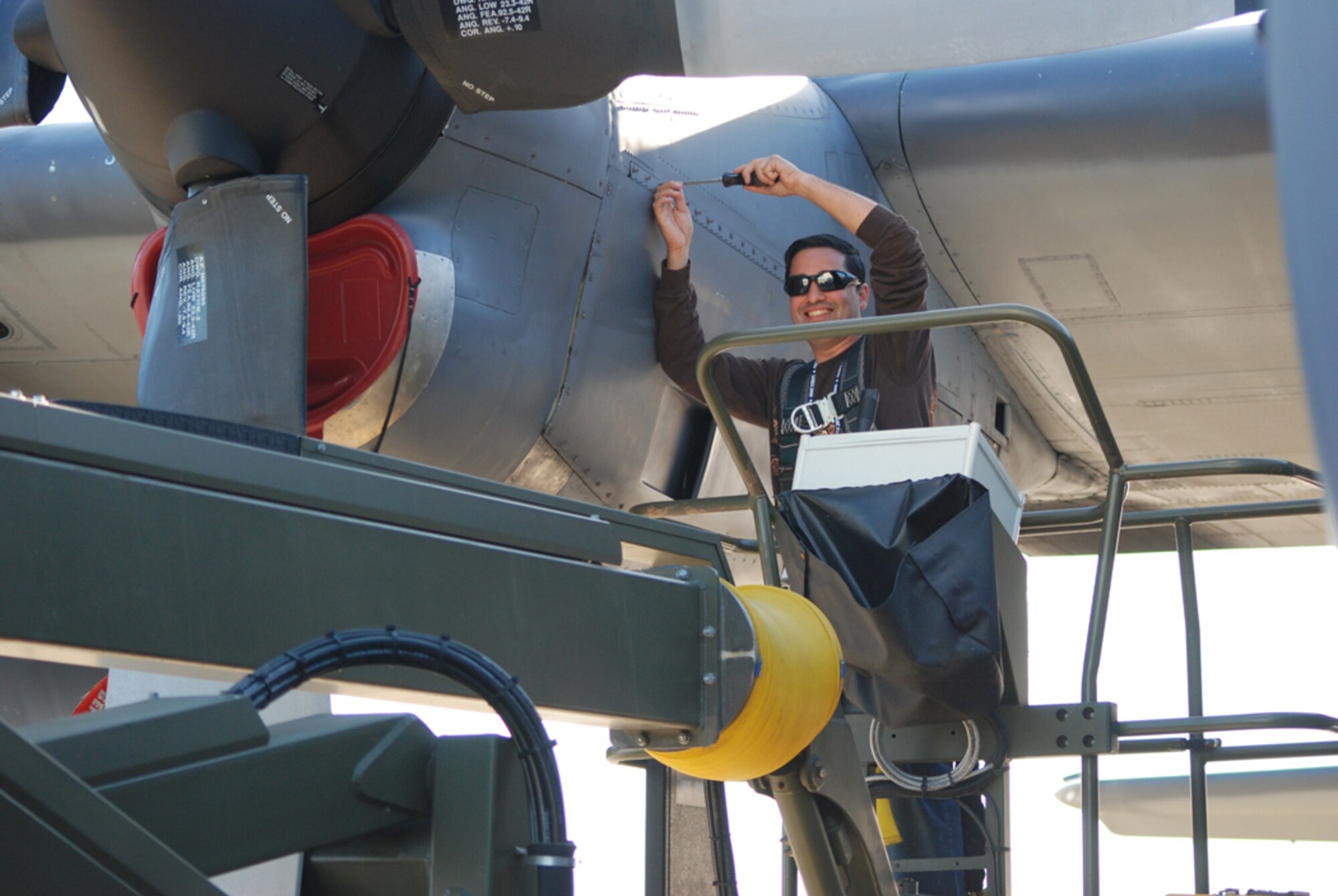 GANDER, Newfoundland - Air Force Reservist Tech. Sgt. Norverto Nieves-Castela, combat rescue crew chief with the 920th Rescue Wing, Patrick Air Force Base, Fla., cranks up maintenance efforts to get this HC-130P/N Hercules aircraft to fly in Canada Search and Rescue 09 Sept. 21. (U.S. Air Force Photo/Capt. Cathleen Snow)