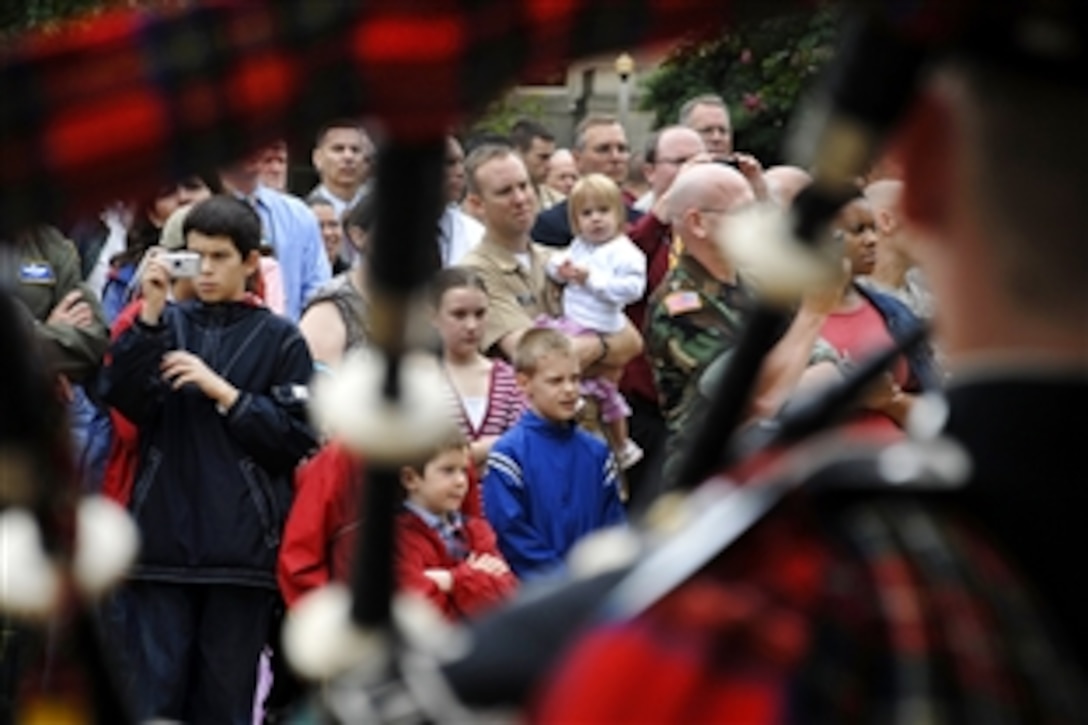 Employees, troops and families watch as the Pipes and Drums of the 1st Battalion Scots Guard perform at the Pentagon, Sept. 25, 2009. The band, which features infantry soldiers, performed to express admiration for its closet allies before they deploy to Helmand province early next year. 