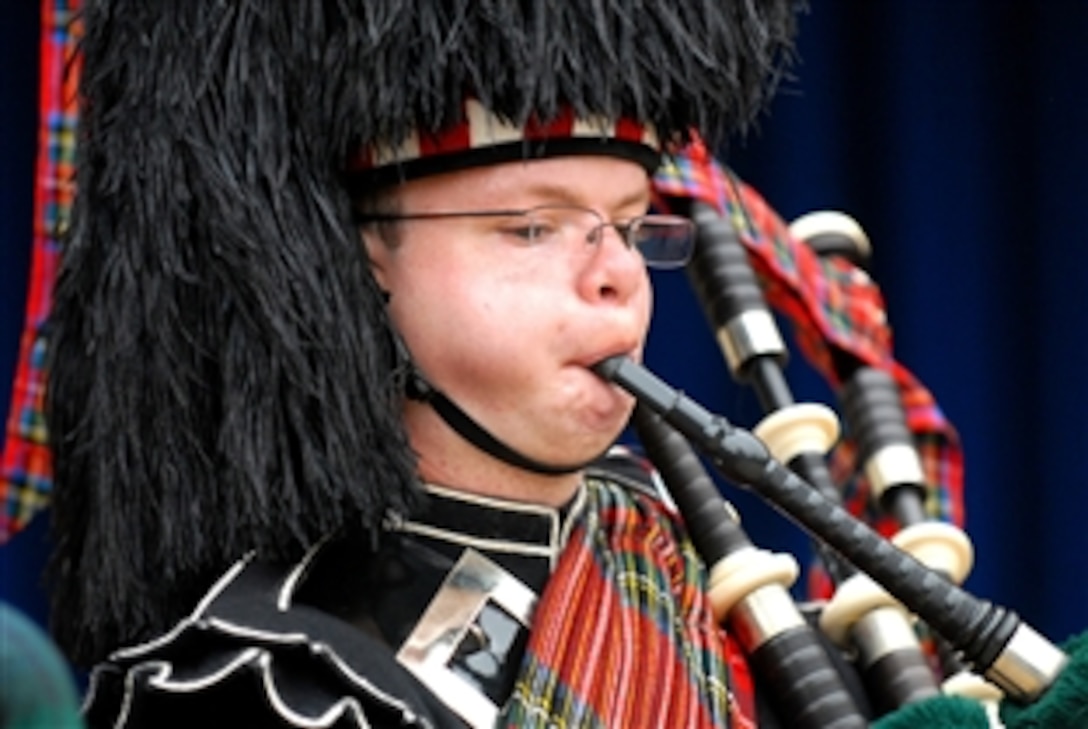 A member of the 1st Battalion of the Scots Guard Pipes and Drums plays the bagpipes for troops, families and employees at the Pentagon, Sept. 25, 2009. The group, members of the British army stationed in Catterick, North Yorkshire, England, will deploy to Helmand province, Afghanistan, early next year.
