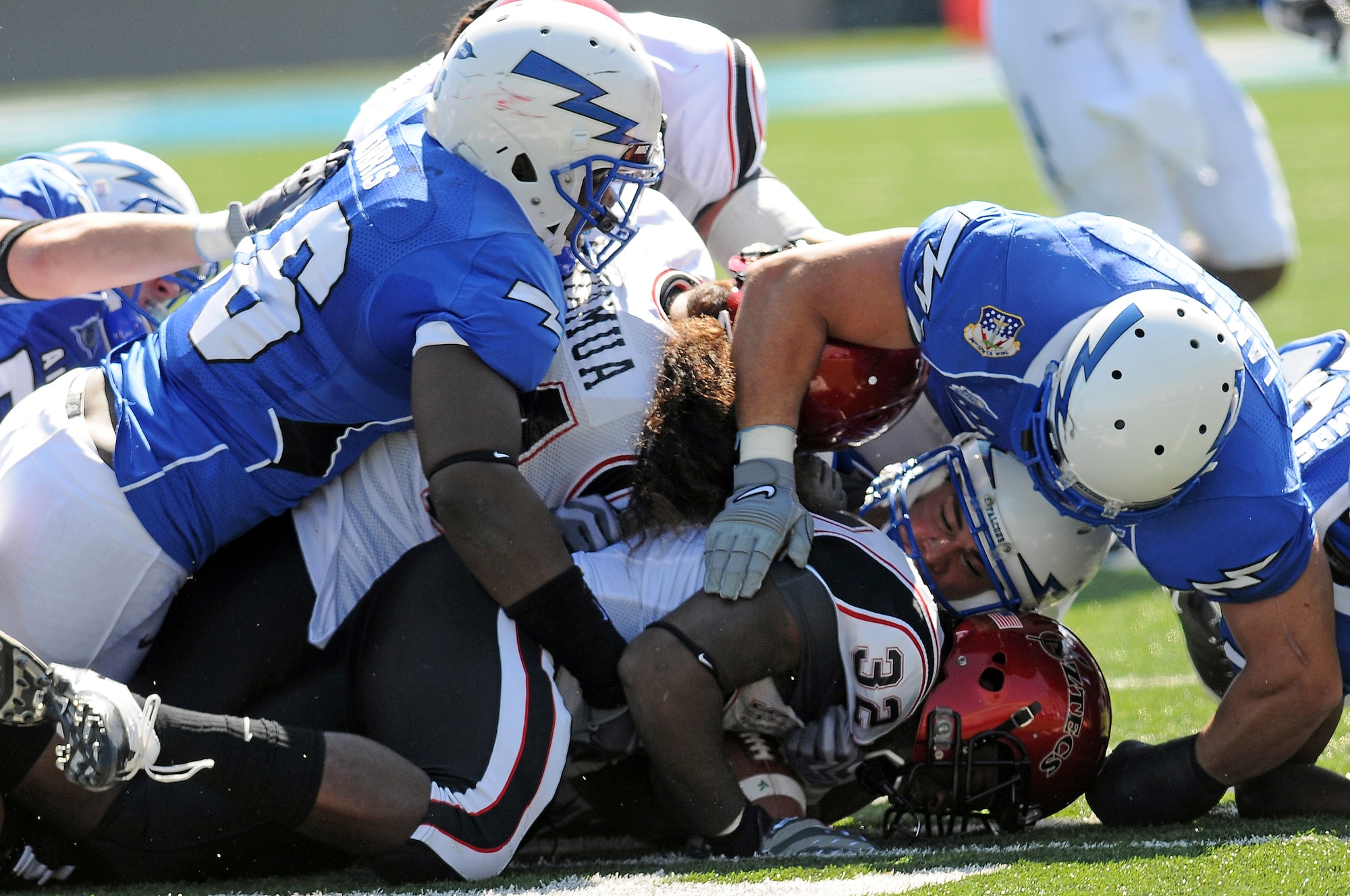 The Air Force defense swarms Aztecs halfback Anthony Miller during the Falcons 26-14 win over San Diego State in Falcon Stadium at the U.S. Air Force Academy, Colo., Sept. 26, 2009. The Aztecs were held to 39 net rushing yards despite Miller's 59 yards on 15 carries. (U.S Air Force photo/Rachel Boettcher)