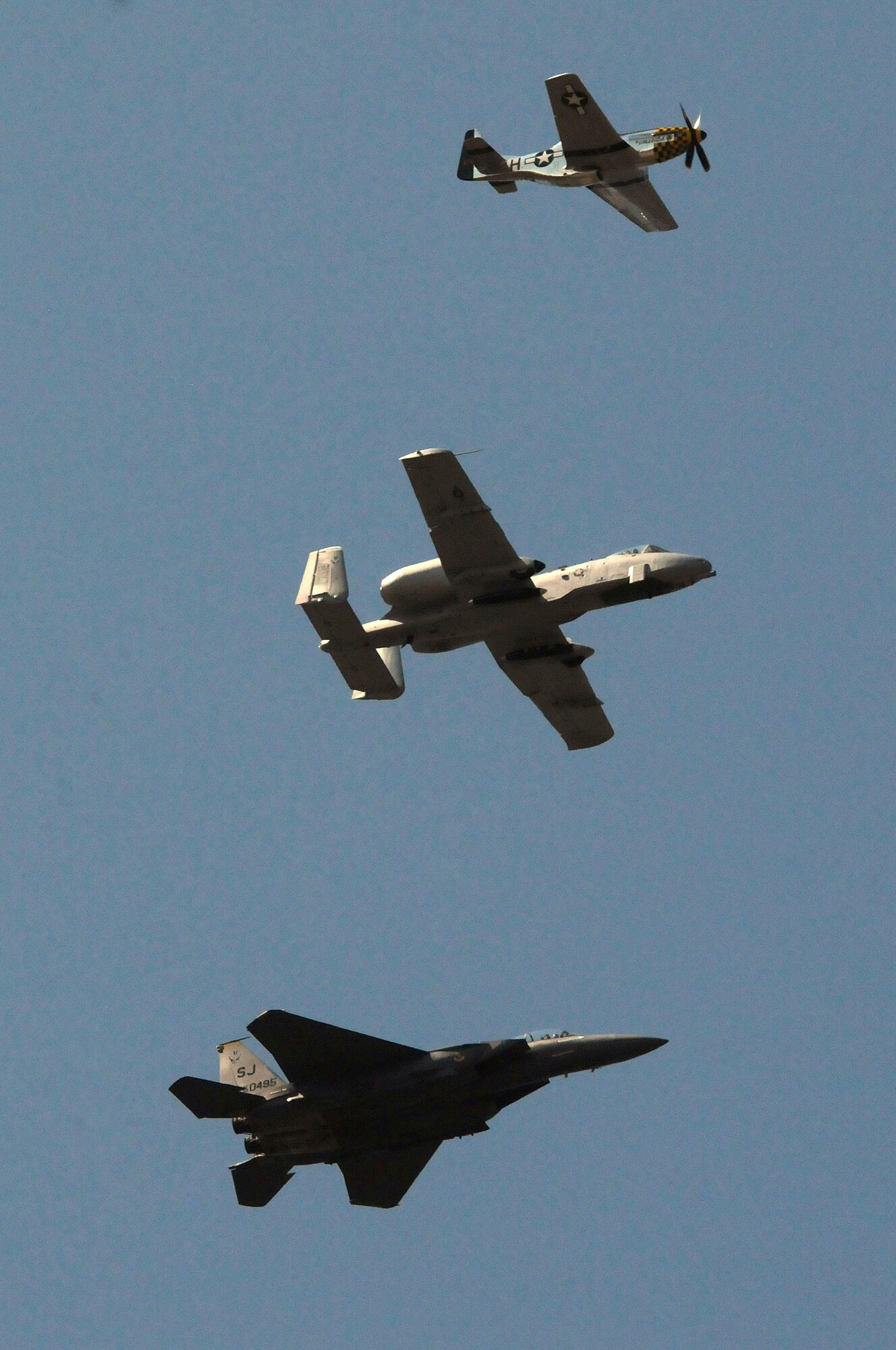 A Heritage Flight consisting of a P-51 Mustang, A-10A Thunderbolt and F-15 Eagle flies over Falcon Stadium, Colo., during Falcons pregame ceremonies for the Air Force-San Diego State game Sept. 26, 2009. (U.S. Air Force photo/Bill Evans)