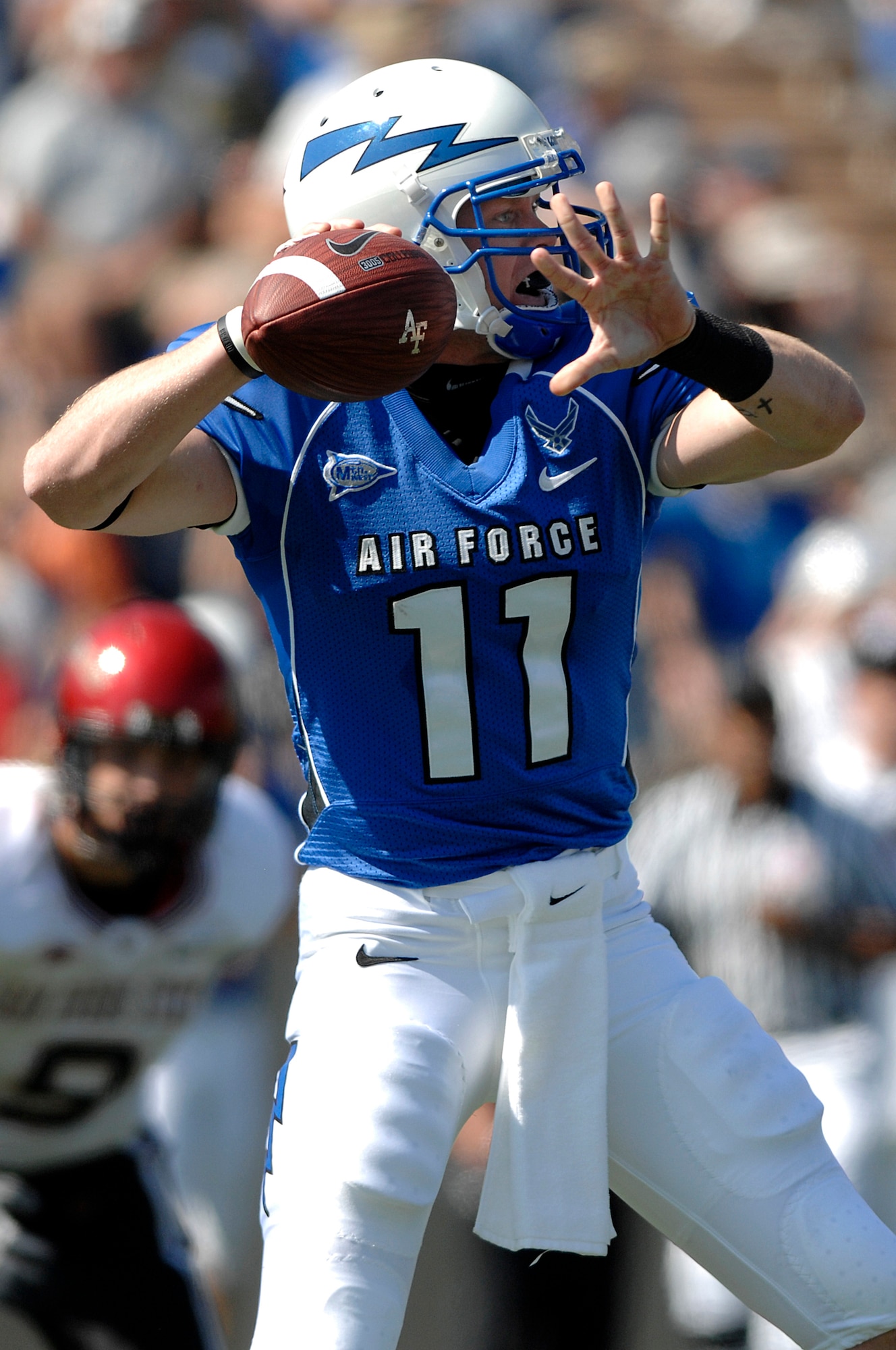 Falcons sophomore quarterback Connor Dietz goes back to pass during Air Force's 26-14 win over San Diego State at Falcon Stadium, Colo., Sept. 26, 2009.  Dietz, a native of Columbus, Ohio, finished the day with 115 total yards, including 51 passing yards on three completions and 64 yards on nine rushes. (U.S. Air Force photo/Mike Kaplan)