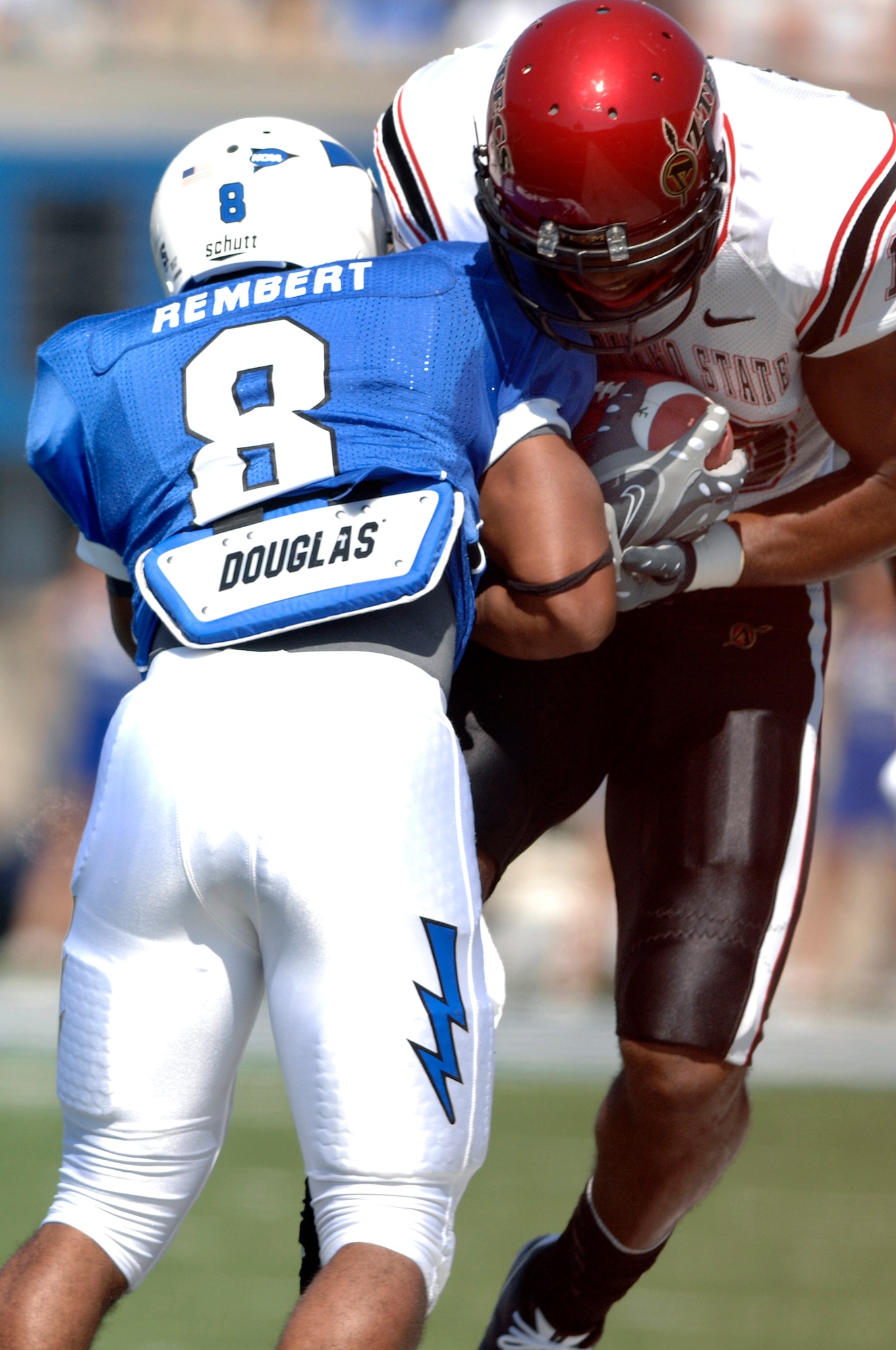Falcons junior defensive back Reggie Rembert tackles Aztecs senior wide receiver Roberto Wallace during Air Force's 26-14 win over San Diego State at Falcon Stadium, Colo., Sept. 26, 2009. Rembert, a native of Flower Mound, Texas, forced a fumble and returned an interception for a touchdown. (U.S. Air Force photo/Mike Kaplan)