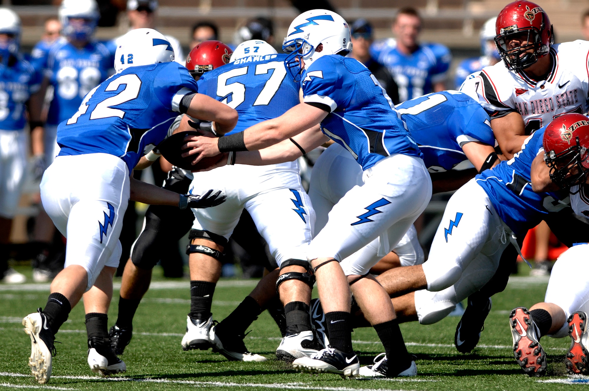 Sophomore quarterback Connor Dietz hands off to running back junior Jared Tew during the Falcons 26-14 win over San Diego State at Falcon Stadium Sept. 26, 2009.  The Falcons are now 3-1 overall and 2-0 in the Mountain West Conference. (U.S Air Force photo/Mike Kaplan)