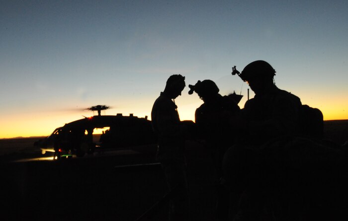 Soldiers from the Utah Army National Guard, 19th Special Forces Group prepare to board an HH-60 Pave Hawk from the 34th Weapons Squadron, United States Air Force Weapons School, Nellis Air Force Base, Nev. during training at Orchard Training Ranges, Idaho on Sept. 16, 2009. The 34th Weapons Squadron is conducting the terminal employment phase of the Nellis Weapons School syllabus. The "T.E." mission objective is to demonstrate and instruct HH-60 weapons employment and landing zone options to maximize weapons effectiveness and quickly recover survivors. (U.S. Air Force photo/ Master Sgt. Kevin J. Gruenwald) released       
