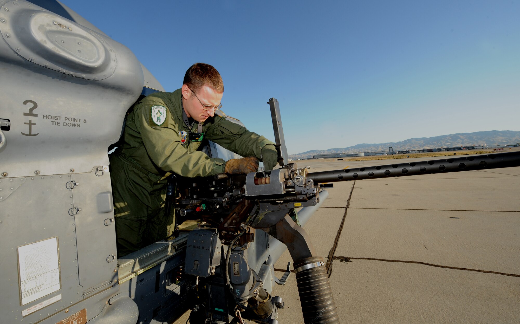 Senior Airman Josh Poe prepares a .50 caliber machine gun on an HH-60 Pave Hawk at Gowan field, Boise Idaho, on Sept. 16, 2009 during the terminal employment phase of the Nellis Air Force Base, Nev. United States Weapons School syllabus. The "T.E." mission objective is to demonstrate and instruct HH-60 weapons employment and landing zone options to maximize weapons effectiveness and quickly recover survivors.  Airman Poe is a flight engineer assigned to the 41st Rescue Squadron, Moody Air Force Base, Ga.

(U.S. Air Force photo/ Master Sgt. Kevin J. Gruenwald) released





 





















  












 











































  












 

























