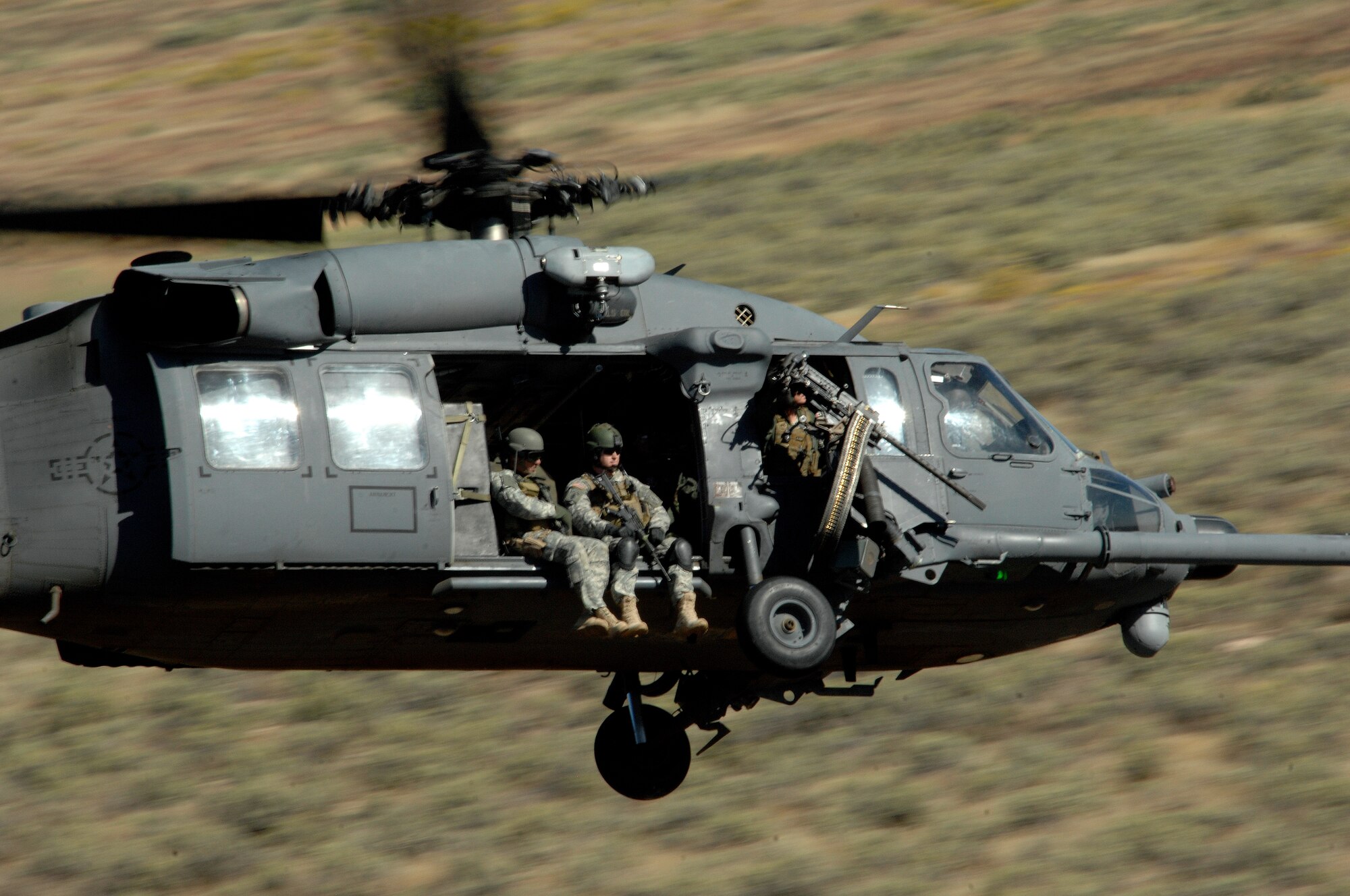 An HH-60 Pave Hawk from 34th Weapons Squadron, United States Air Force Weapons School, Nellis Air Force Base, Nev. moves into firing position over the Orchard Training Ranges, Idaho on Sept. 16, 2009. The 34th Weapons Squadron is conducting the terminal employment phase of the Nellis Weapons School syllabus. The "T.E." mission objective is to demonstrate and instruct HH-60 weapons employment and landing zone options to maximize weapons effectiveness and quickly recover survivors. 

(U.S. Air Force photo/ Master Sgt. Kevin J. Gruenwald) released






 





















  












 











































  












 

























