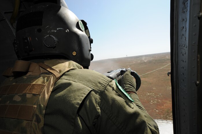 Tech. Sgt. Michael Vincent, flight engineer, 34th Weapons Squadron, United States Air Force Weapons School, Nellis Air Force Base, Nev. fires on targets with a .50 caliber machine gun over Orchard Training Ranges, Idaho on Sept. 16, 2009 during the terminal employment phase of the Nellis Weapons School syllabus. The "T.E." mission objective is to demonstrate and instruct HH-60 weapons employment and landing zone options to maximize weapons effectiveness and quickly recover survivors. 

(U.S. Air Force photo/ Master Sgt. Kevin J. Gruenwald) released




 





















  












 











































  












 


























