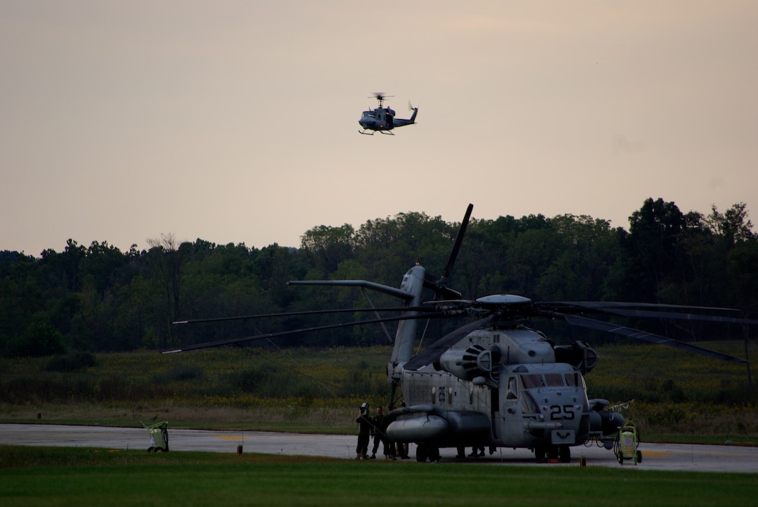 Chip Stratmann, project volunteer and retired Marine major, swings a pickaxe into the future site of one the five guzzlers placed on Camp Pendleton for National Public Lands Day, Sept. 26.