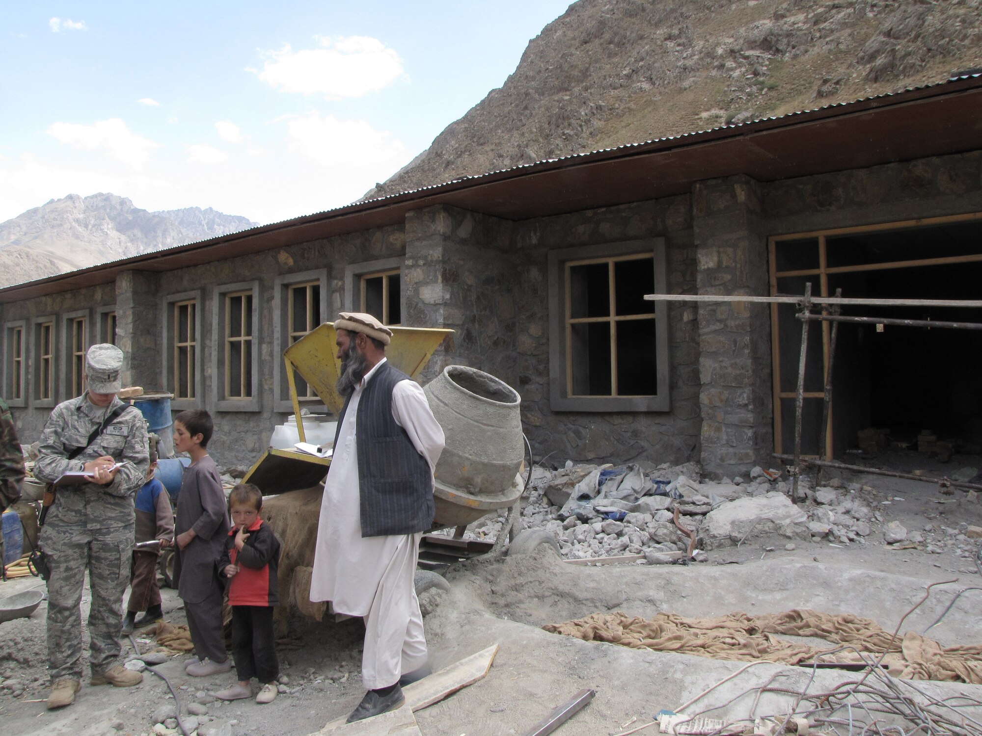 PANJSHIR, Afghanistan - A civil engineer with the provincial reconstruction team here, 1st Lt. Kate Miles takes notes on construction progress of a new school Sept. 7, 2009. Lieutenant Miles and her team ensure contractors perform work according to code. She is a Rochester, N.Y., native and deployed from Luke Air Force Base, Ariz. (U.S. Air Force photo/Staff Sgt. J.G. Buzanowski)    