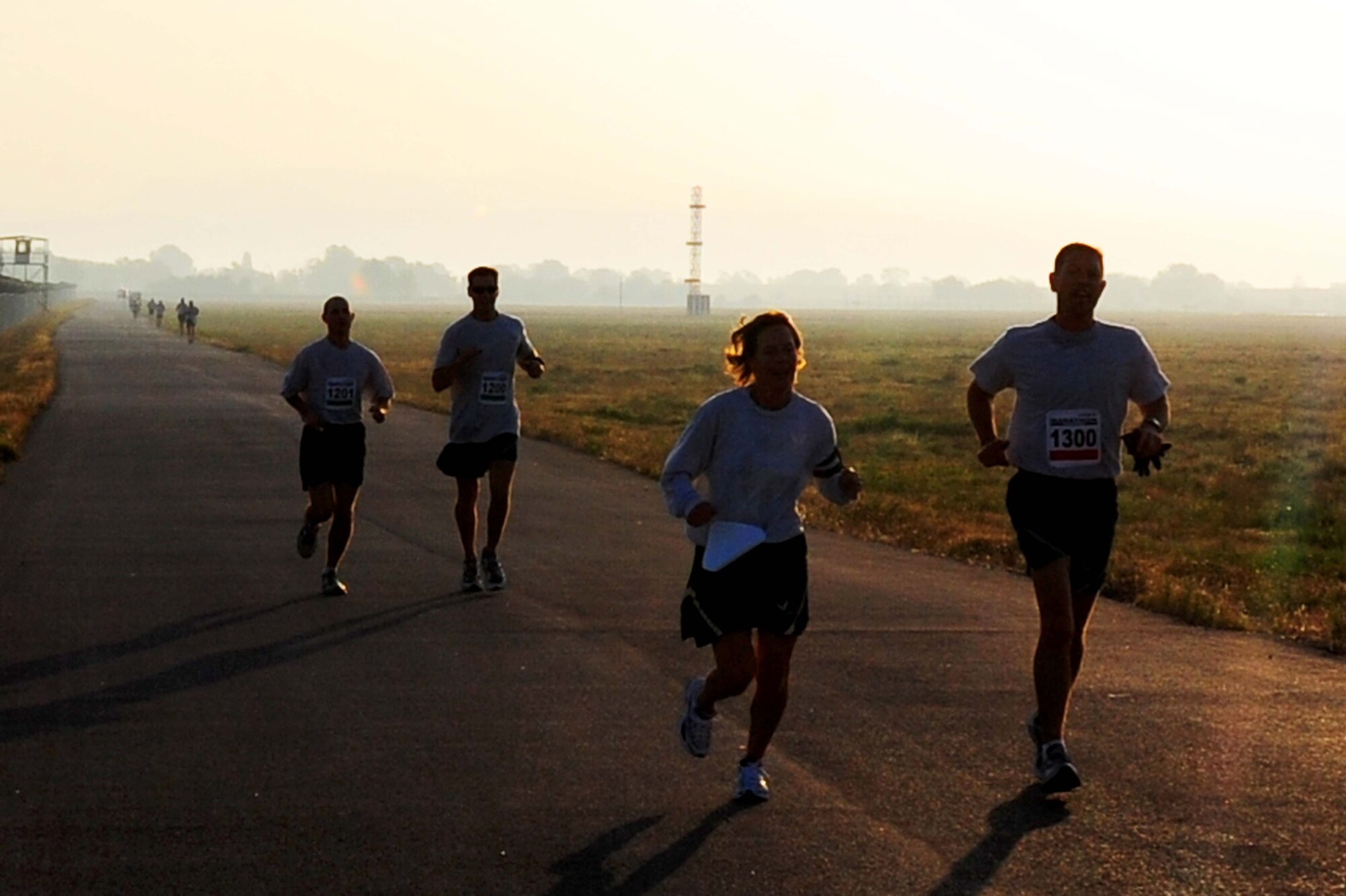 TRANSIT CENTER AT MANAS, Kyrgyzstan -- Participants of the marathon at the Transit Center keep a good pace during the run on Sept. 19, 2009. A total of seven, of all the runners, completed the 26.2 trek on their own at Manas. (U.S. Air Force photo/Senior Airman Steele C. G. Britton)