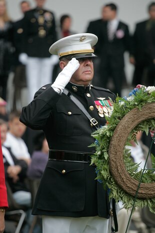 Chief Warrant Officer Nick D'Andrea, special operations officer, salutes the John Basilone Statue after laying a wreath with Lt. Gen. Duane D. Thiessen, Deputy Commandant for Programs and Resources, Sept. 27. The Raritan, N.J., celebration of the town's Medal of Honor recipient is the largest military parade in the nation. (Marine Corps photo by Sgt. Randall A. Clinton)