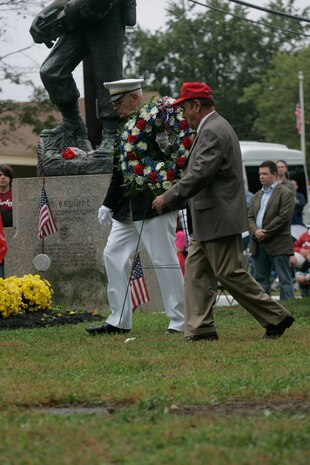 Donald Basilone, younger brother to John, carrys a wreath to the John Basilone Statue in Raritan, N.J., Sept 27. The celebration of the town's Medal of Honor recipient is the largest military parade in the nation.(Marine Corps photo by Sgt. Randall A. Clinton) ::r::::n::