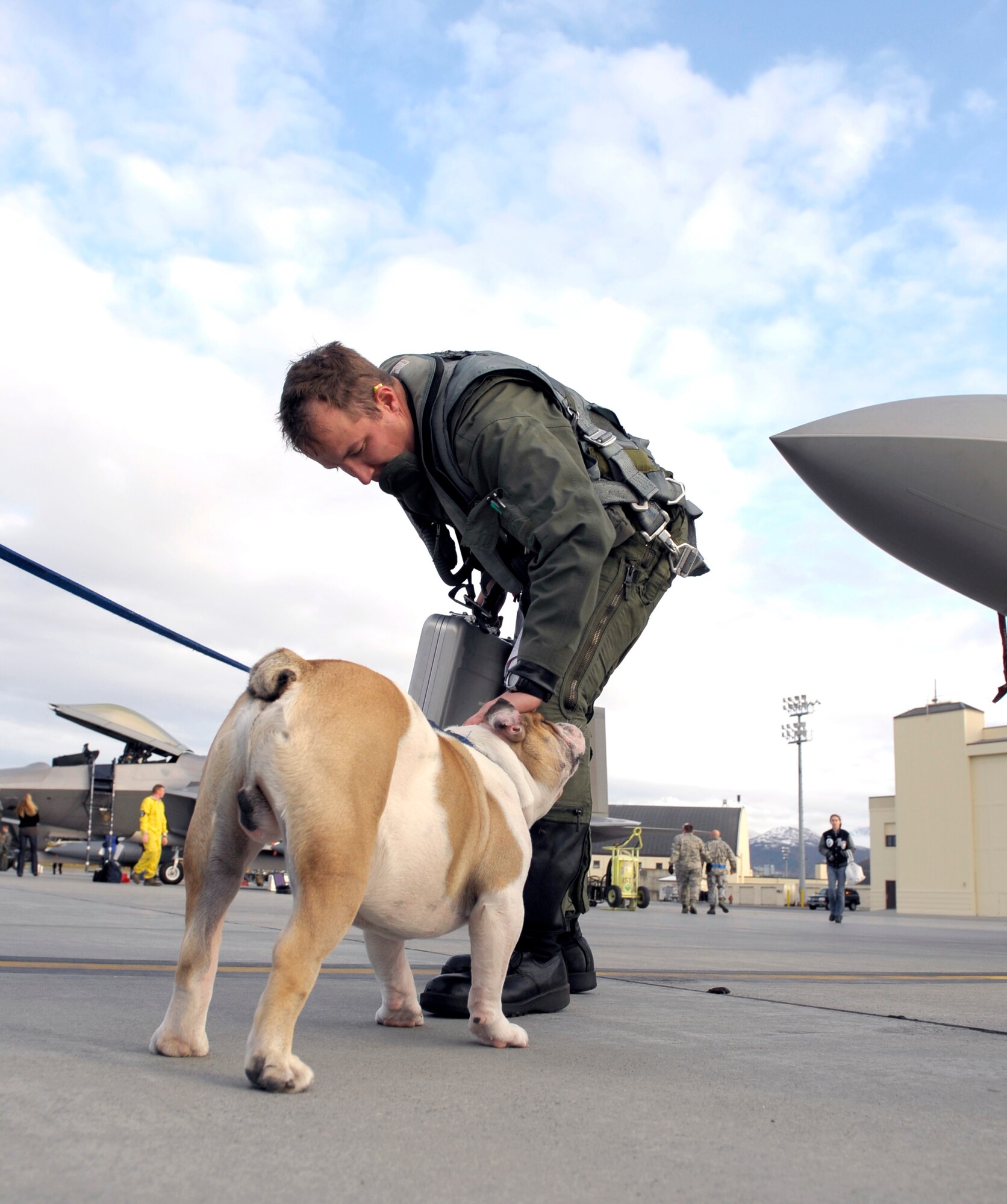 ELMENDORF AIR FORCE BASE, Alaska -- Fado, the mascot for the 525th Fighter Squadron, greets F-22 Raptor pilot, Capt. Adam Ciarella after returning from a four-month deployment to Andersen Air Force Base, Guam. (U.S. Air Force photo/Master Sgt. Keith Brown)