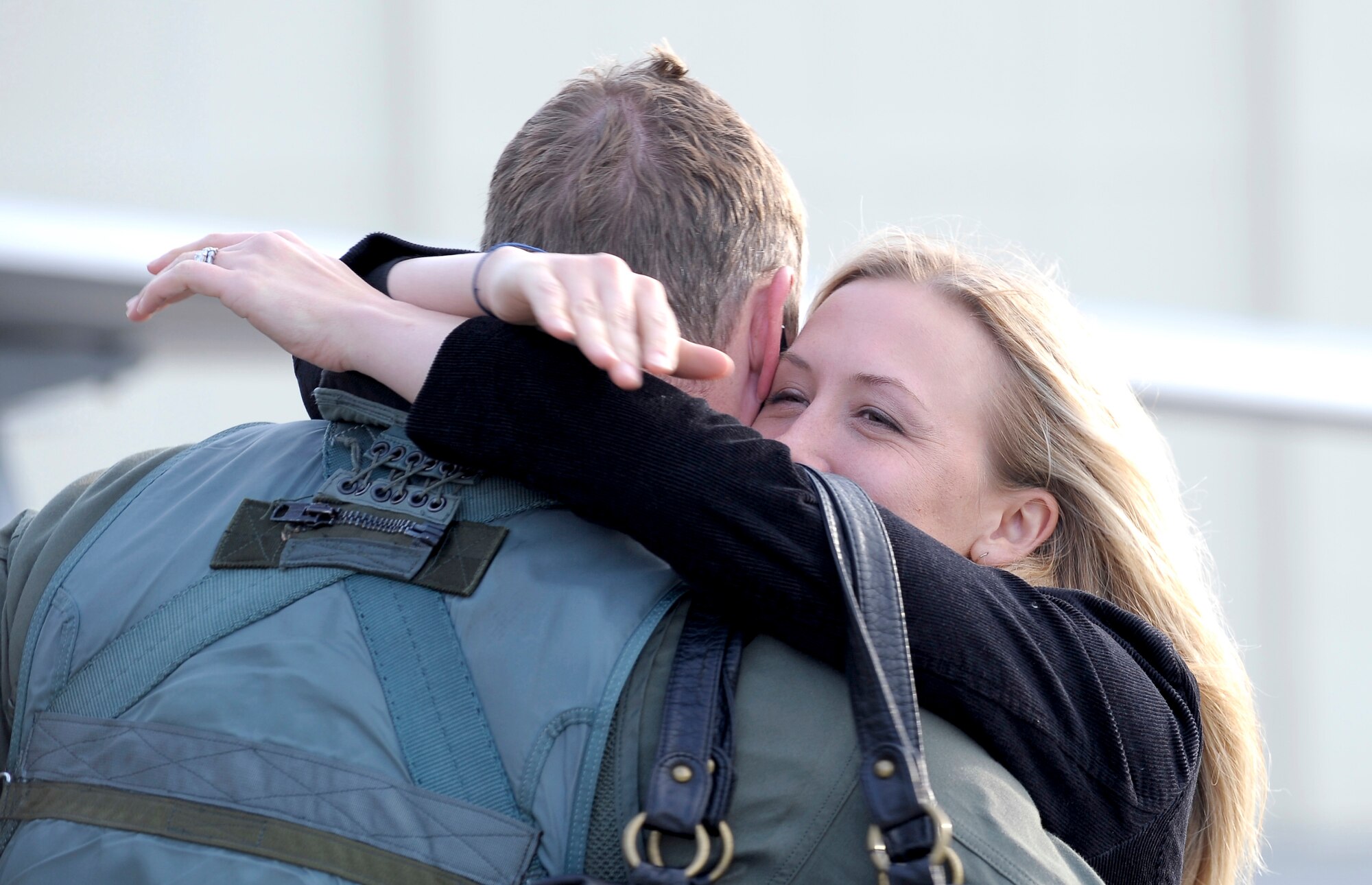 ELMENDORF AIR FORCE BASE, Alaska -- Kelli Phifer greets her husband, Capt. Josh Phifer upon his return from a four-month deployment to Andersen Air Force Base, Guam. Phifer is an F-22 Raptor pilot assigned to the 525th Fighter Squadron here. (U.S. Air Force photo/Master Sgt. Keith Brown)