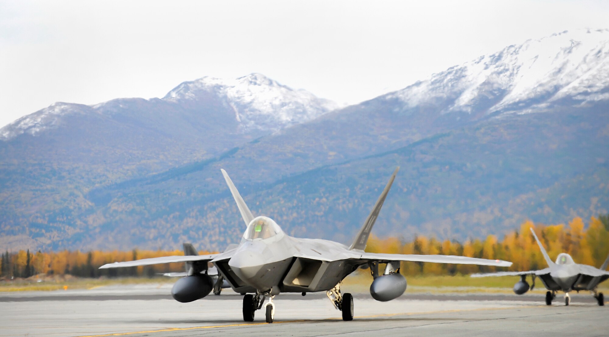 ELMENDORF AIR FORCE BASE, Alaska -- F-22 Raptors returning from a four-month deployment to Andersen Air Force Base, Guam, taxi to parking spots where family and friends await the pilots from the 525th Fighter Squadron. (U.S. Air Force photo/Master Sgt. Keith Brown)