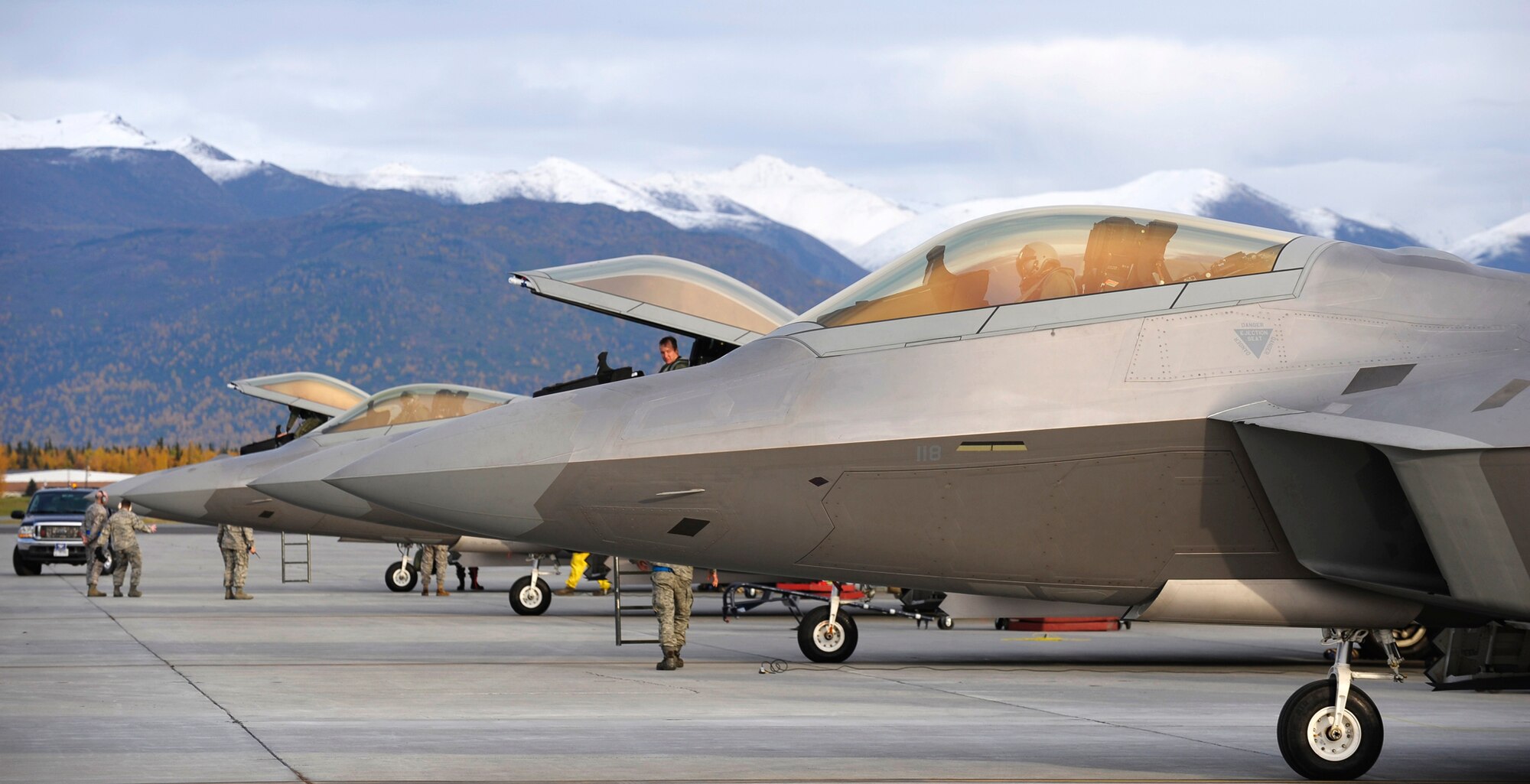 ELMENDRF AIR FORCE BASE, Alaska -- Four F-22 Raptors returned to fresh snow on the mountains after pilots and maintainers from the 525th Fighter Squadron spent four months deployed to Andersen Air Force Base, Guam. This was the squadron first deployment since being activitated under the 3rd Wing nearly two years ago. (U.S. Air Force photo/Master Sgt Keith Brown)