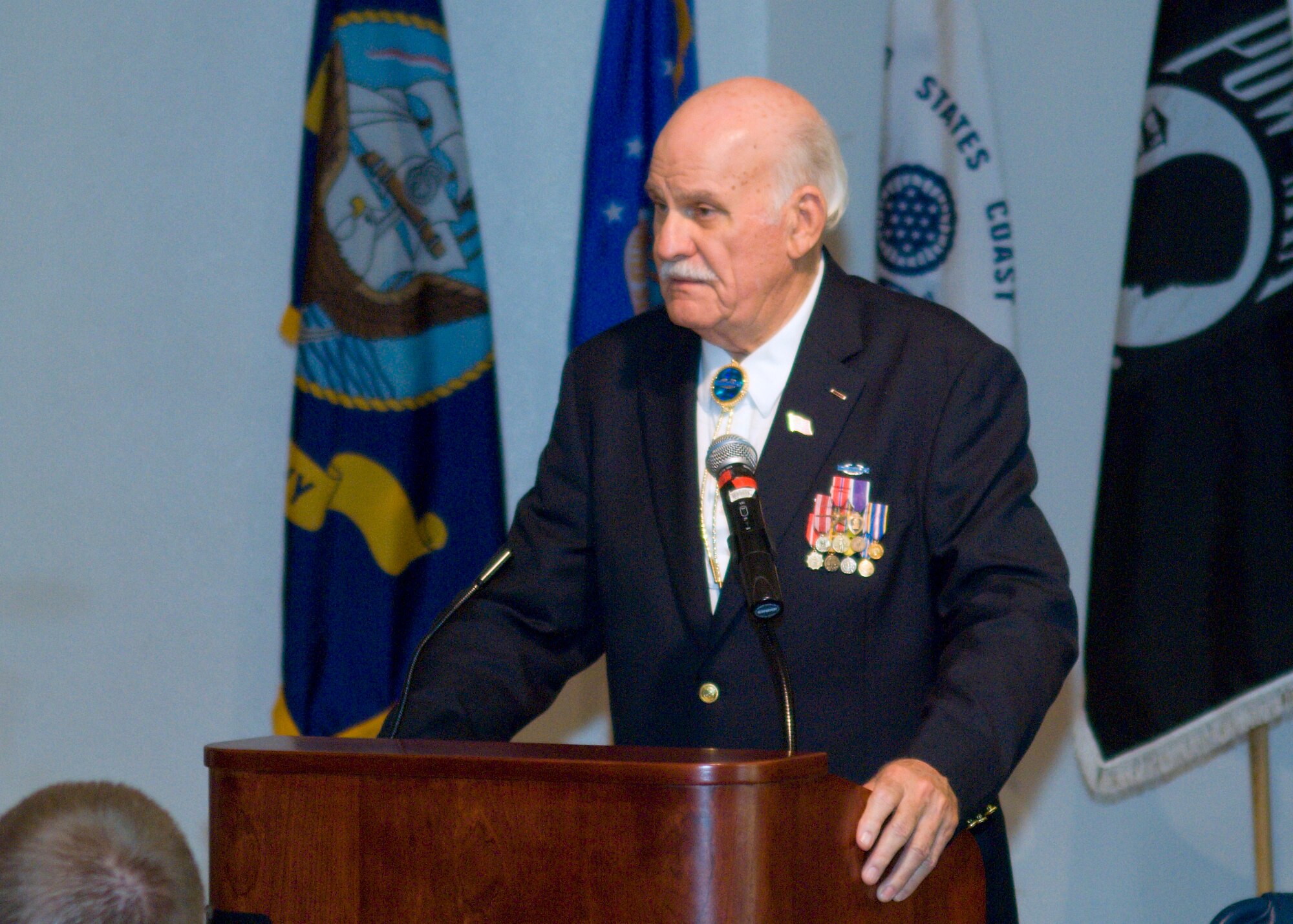 Joseph Johnson, a former prisoner of war, talks to Team Edwards during the POW/MIA Day luncheon at Club Muroc Sept. 18. During his speech Mr. Johnson discussed how he joined the Army and his experiences during World War II. (Air Force photo Mike Cassidy) 