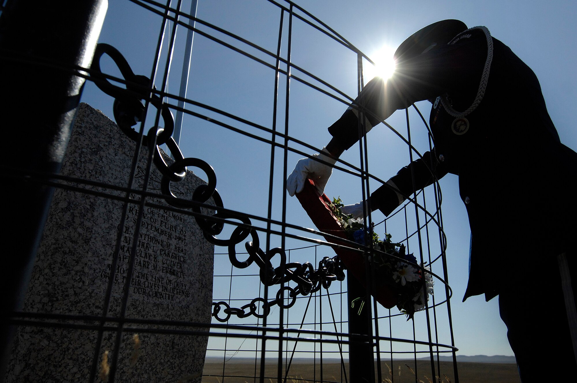 Airman 1st Class Brandon Bussey, 28th Logistics Readiness Squadron traffic management journeyman, places a wreath at the Fury-2 Memorial near Ekalaka, Mont., Sept. 26. The memorial is in remembrance of four Airmen who lost their lives when a B-1 crashed 12 years ago. (U.S. Air Force photo/Airman 1st Class Joshua J. Seybert)