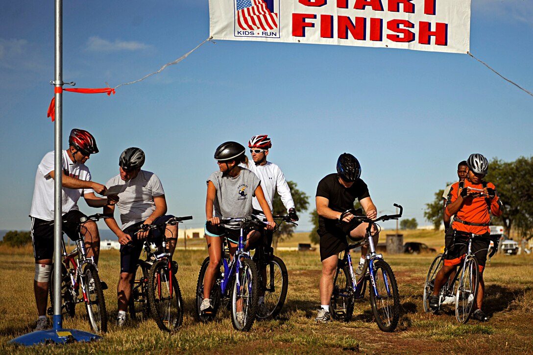 Competitors of the Raider Challenge begin by interpreting clues to where the next checkpoint is here, Sept. 25. The challenge consisted of a bike ride, run and canoe race. (U.S. Air Force photo/Airman 1st Class Matthew Flynn)