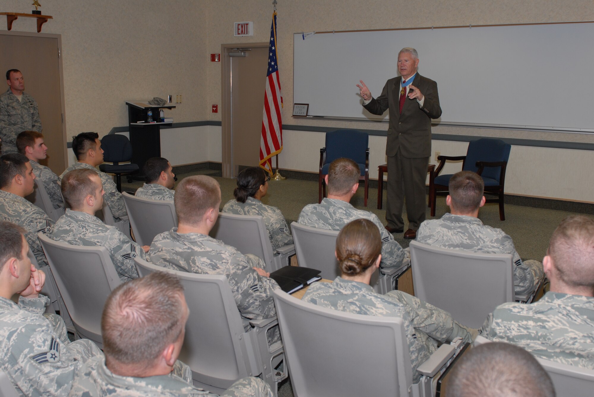 Col. Leo Thorsness, former prisoner of war, answers questions from Airman Leadership school students at Bldg. 711 Sept. 25. Colonel Thorsness is a retired Air Force pilot, Vietnam prisoner of war, and Congressional Medal of Honor recipient. (U.S. Air Force photo by Senior Airman Nathan Allen)