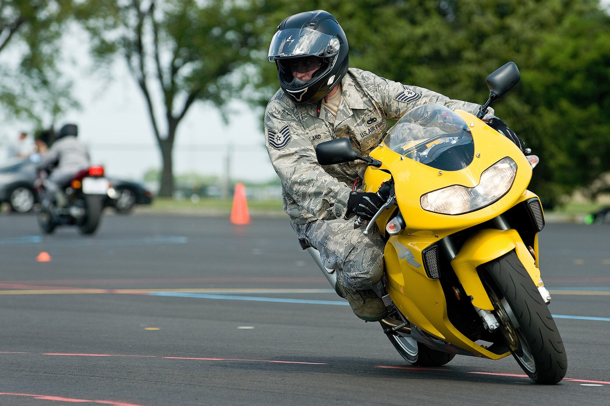 Tech. Sgt. John Willard rides through the Eagle's Nest motorcycle safety course Aug. 21 following a tactical demonstration from a member of the Dover Police Department motorcycle division for a 436th Maintenance Squadron motorcycle safety course. (U.S. Air Force photo/Roland Balik)