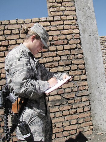 1st Lt. Kate Miles takes notes on construction progress of a new government building Sept. 6, 2009, in Panjshir, Afghanistan. Lieutenant Miles, a civil engineer with the provincial reconstruction team, and her team ensure contractors perform work according to code. She is a Rochester, N.Y., native and deployed from Luke Air Force Base, Ariz. (U.S. Air Force photo/Staff Sgt. J.G. Buzanowski) 
