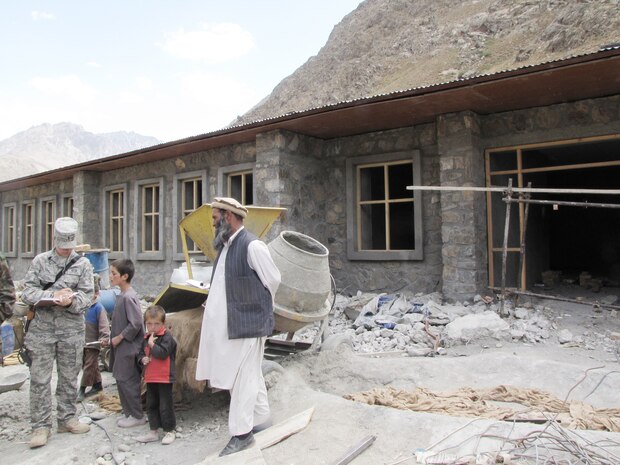 1st Lt. Kate Miles takes notes on construction progress of a new government building Sept. 6, 2009, in Panjshir, Afghanistan. Lieutenant Miles, a civil engineer with the provincial reconstruction team, and her team ensure contractors perform work according to code. She is a Rochester, N.Y., native and deployed from Luke Air Force Base, Ariz. (U.S. Air Force photo/Staff Sgt. J.G. Buzanowski) 