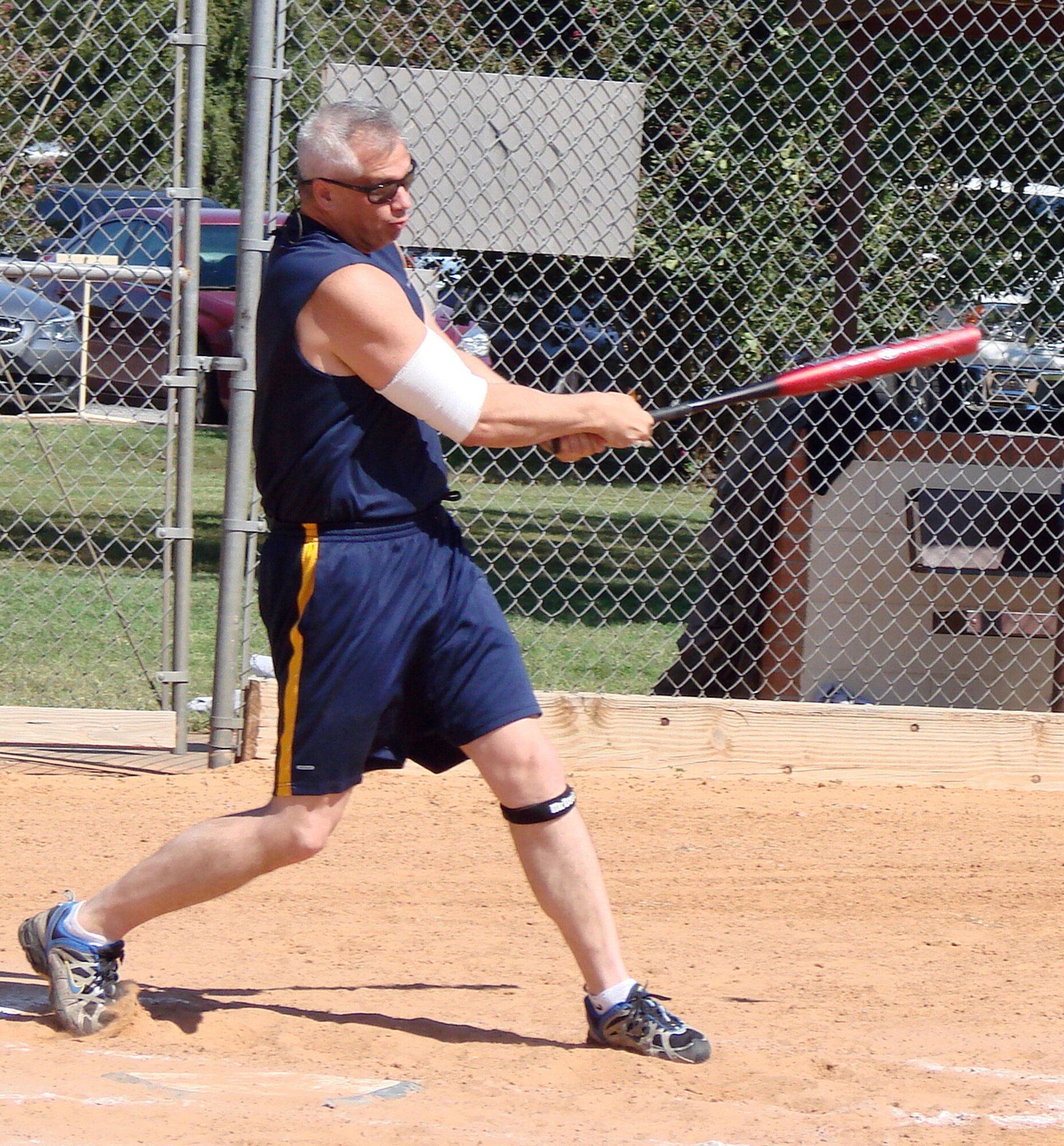 Chief Master Sgt. M. Kenui Balutski, 71st Flying Training Wing command chief, takes a swing at the ball during the Focus 5/6 Softball Challenge held Sept. 25 on ball field No. 1. Junior enlisted took on senior leadership to raise money for the 2009 Vance Combined Federal Campaign. (U.S. Air Force photo/ Joe B. Wiles)