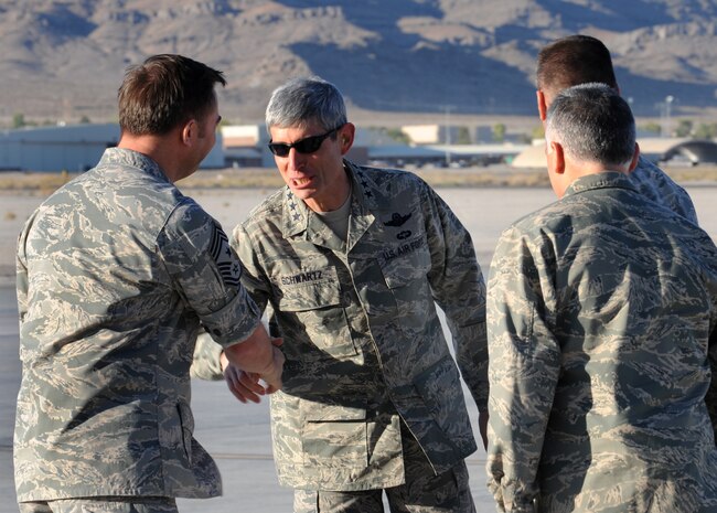 CREECH AIR FORCE BASE, Nev. -- Chief Master Sgt. Richard Cromer, 432nd Wing command chief, greets Gen. Norton A. Schwartz, Chief of Staff of the United States Air Force, Sept. 25. The 432nd Wing hosted a graduation for the class of 09-12 Unmanned Aerial Systems sensor operators and pilots. Schwartz flew into Creech AFB, to  preside over the first UAS graduation. (U.S. Air Force photo by Airman 1st Class Brett Clashman) 