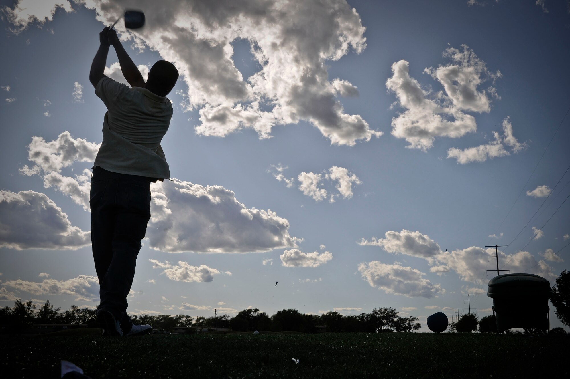 CANNON AIR FORCE BASE, N.M. -- Senior Airman Nathan Rogers, 27th Special Operations Logistics Readiness Squadron, tees-off on the 12th hole here, Sept. 25. The Chief's group held a golf tournament, open to all military and Department of Defense civilian personnel. The tournament consisted of a four person team, using the best ball for each shot attempted by the team.  (U.S. Air Force photo/ Senior Airman Erik Cardenas)
