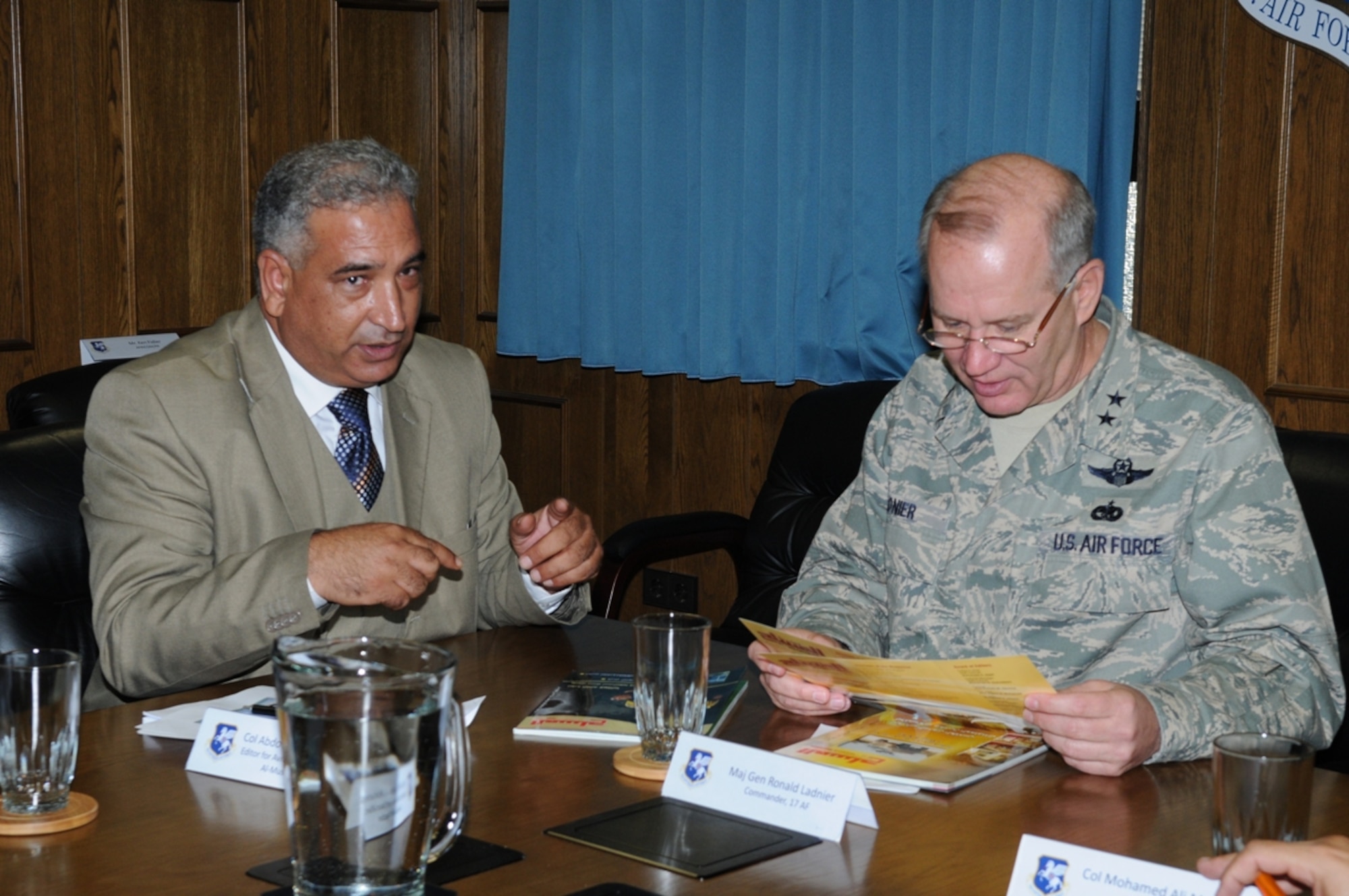 RAMSTEIN AIR BASE, Germany -- Lt. Col. Mohamed Abdulghani, an editor with Al Musaahl, a Libyan Defense Magazine, shows a copy of the publication to 17th Air Force Commander Maj. Gen. Ron Ladnier during a Libyan military media delegation visit to 17th's Ramstein HQ Sept. 23. (USAF photo by Maj. Paula Kurtz)