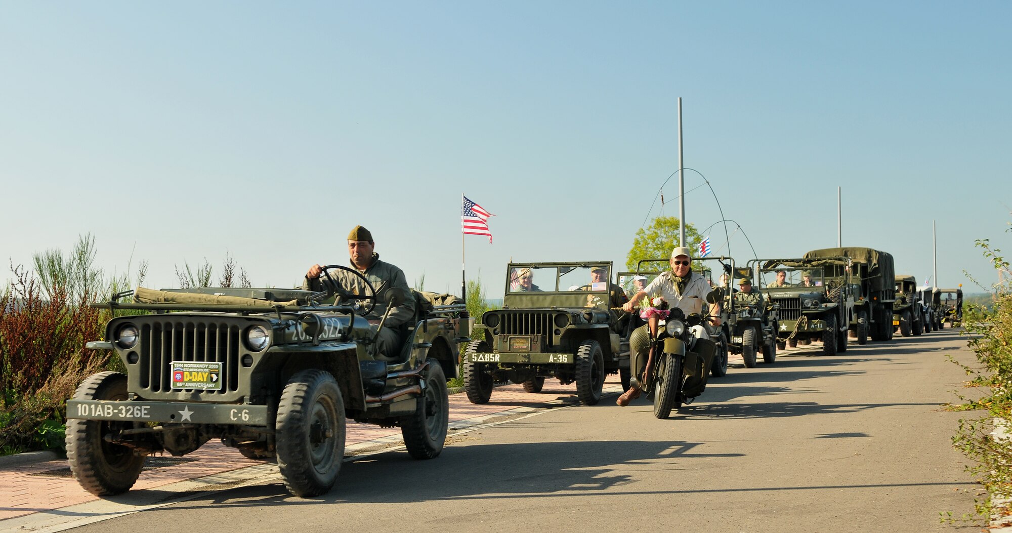 SPANGDAHLEM AIR BASE, Germany -- A convoy of actors, servicemembers and veterans advance down a road in Boulaide, Luxembourg, during the World War II Battle of the Bulge Commemoration Sept. 26. The event took place to honor the 65th Anniversary of the Liberation of Luxembourg. The mayor and town unveiled a monument with a plaque for a B-17 that crashed there during the Battle of the Bulge. (U.S. Air Force photo/ Airman 1st Class Nick Wilson)