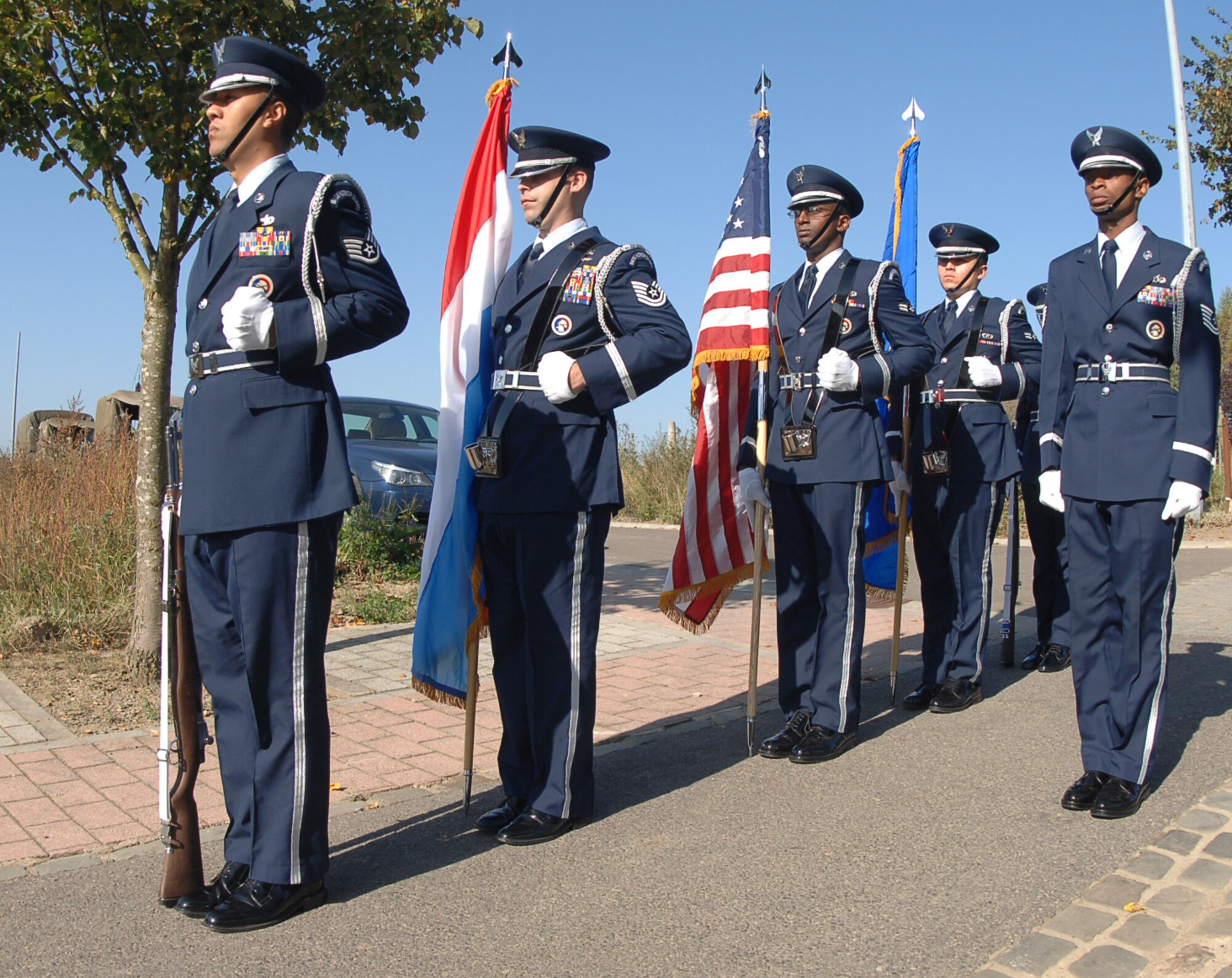 SPANGDAHLEM AIR BASE, Germany -- The Spangdahlem Air Base Honor Guard goes to attention during the World War II Battle of the Bulge Commemoration in Boulaide, Luxembourg, Sept. 26. The event took place to honor the 65th Anniversary of the Liberation of Luxembourg. The mayor and town unveiled a monument with a plaque for a B-17 that crashed there during the Battle of the Bulge. (U.S. Air Force photo/Airman 1st Class Nick Wilson)
