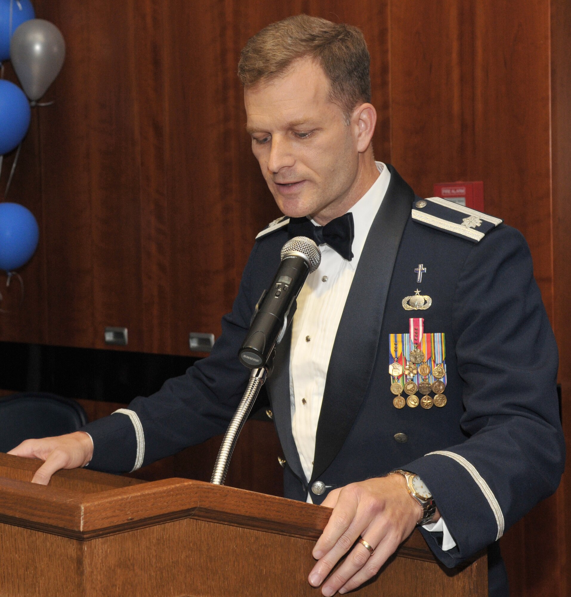 SPANGDAHLEM AIR BASE Germany -- Chaplain (Lt. Col.) Dondi Costin gives the invocation during the 2009 Air Force Ball here at Club Eifel Sept. 25. Sabers from across the 52nd Fighter Wing were invited to attend the event, which observed the Air Force's birthday and Airmen's contributions around the globe.  This year's theme was "All in...Globally Engaged" to recognize the unique role the Air Force fulfills in missions across the world. (U.S. Air Force photo/Airman 1st Class Nick Wilson)