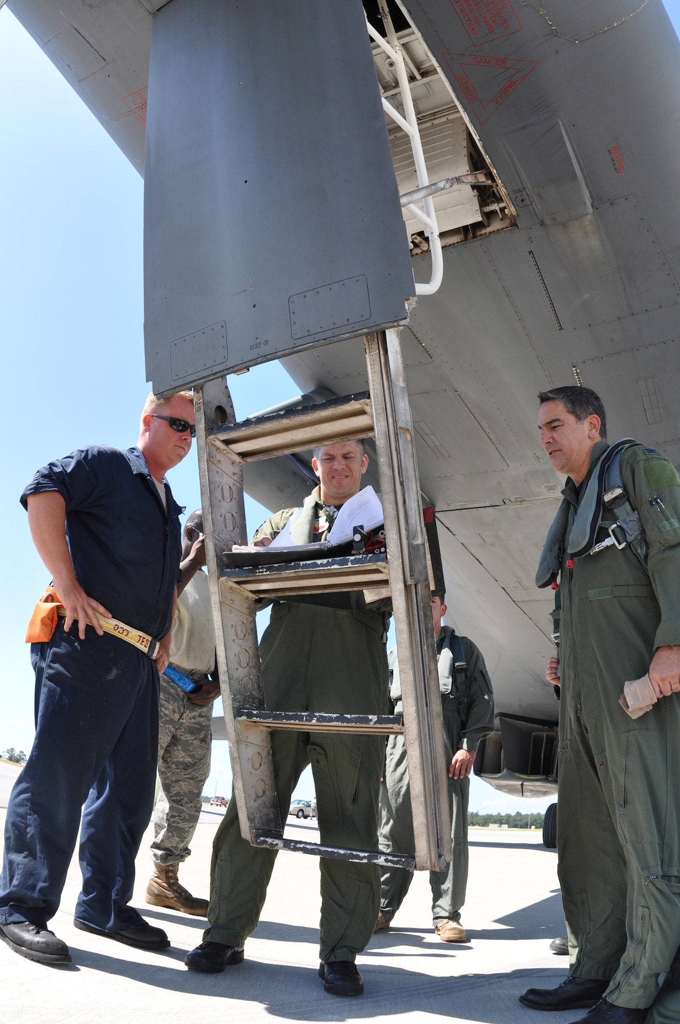 EGLIN AIR FORCE BASE, Fla. -- Staff Sgt. Dallas Osburn, 337th Test and Evaluation Squadron, Maj. Neil McCracken, 53rd Test Management Group, and Col. Mick  Guthals, 53rd Wing vice commander, perform their preflight inspection of the B-1B Lancer before its return flight to Dyess Air Force Base, Texas. Two B-1B Lancers were brought from Dyess Air Force Base, Texas, last week in an effort to better defend the aircraft for today’s warfighters and prove the strength of new software. The B-1 is a long range, multi-role, heavy bomber with a wingspan of 137 feet, and is capable of intercontinental flight unrefueled. (U.S. Air Force photo/ Sam King)