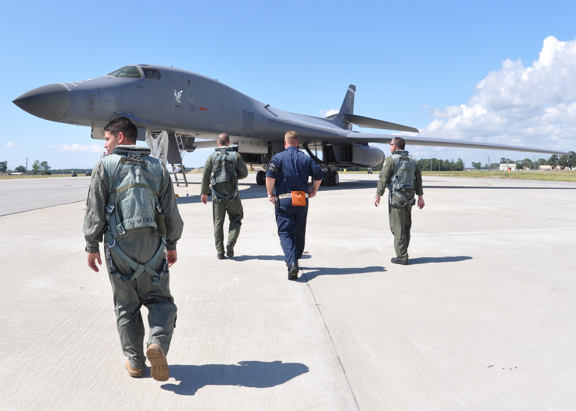 EGLIN AIR FORCE BASE, Fla. -- Senior Airman Matthew Tutza, 7th Air Maintenance Squadron, walks toward a B-1B Lancer for his first ride in the aircraft as part of an incentive flight Sept. 24, here. Two B-1B Lancers were brought from Dyess Air Force Base, Texas, for test missions last week in an effort to better defend the aircraft for today’s warfighters and prove the strength of new software. The B-1 is a long range, multi-role, heavy bomber with a wingspan of 137 feet, and is capable of intercontinental flight unrefueled. (U.S. Air Force photo/ Sam King)