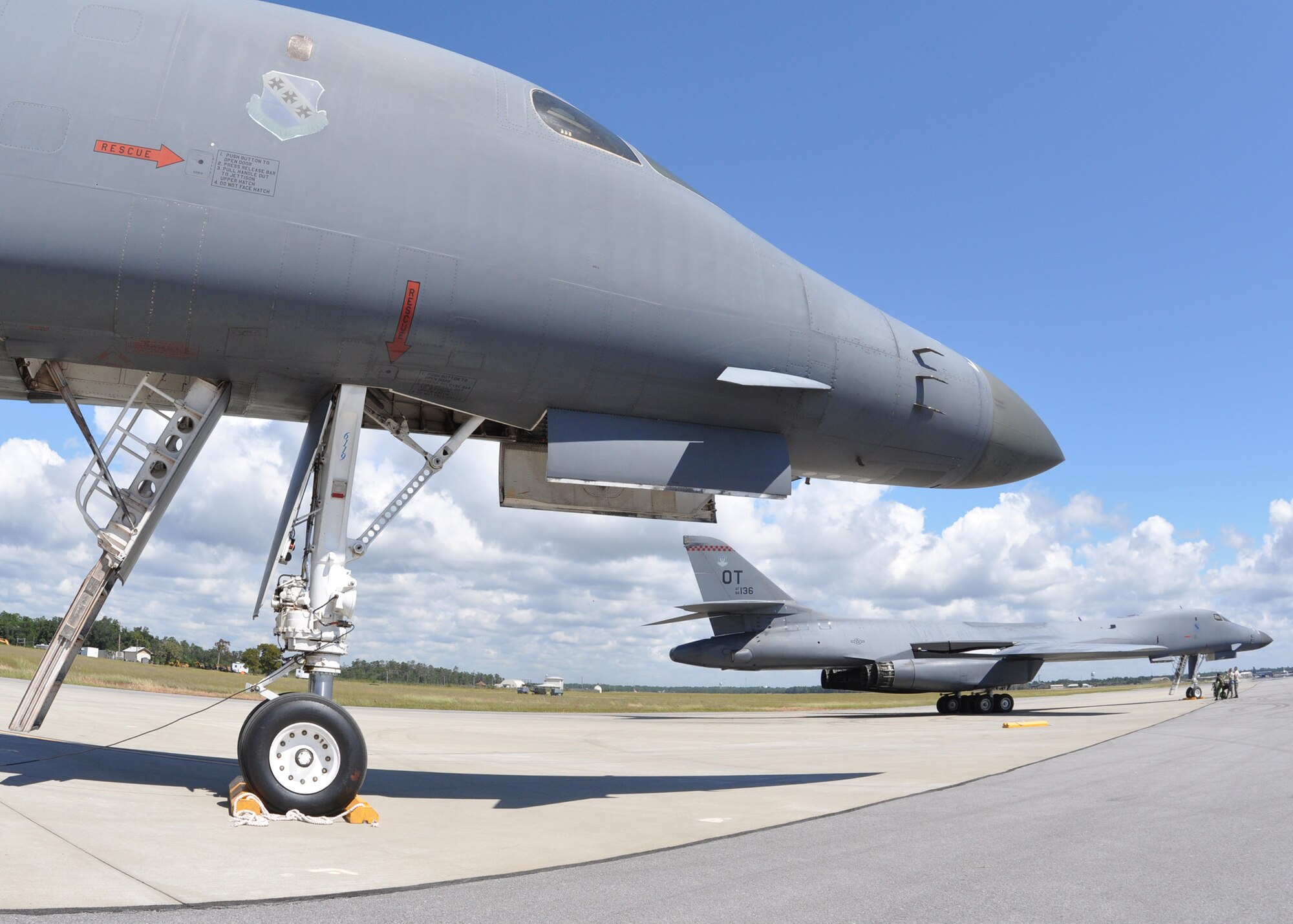EGLIN AIR FORCE BASE, Fla. -- Two B-1B Lancers await taxi clearance the runway here, Sept. 24 for a test mission. Two B-1s were brought from Dyess Air Force Base, Texas, for test missions last week in an effort to better defend the aircraft for today’s warfighters and prove the strength of new software. The B-1 is a long range, multi-role, heavy bomber with a wingspan of 137 feet, and is capable of intercontinental flight unrefueled. (U.S. Air Force photo/ Airman Sam King)