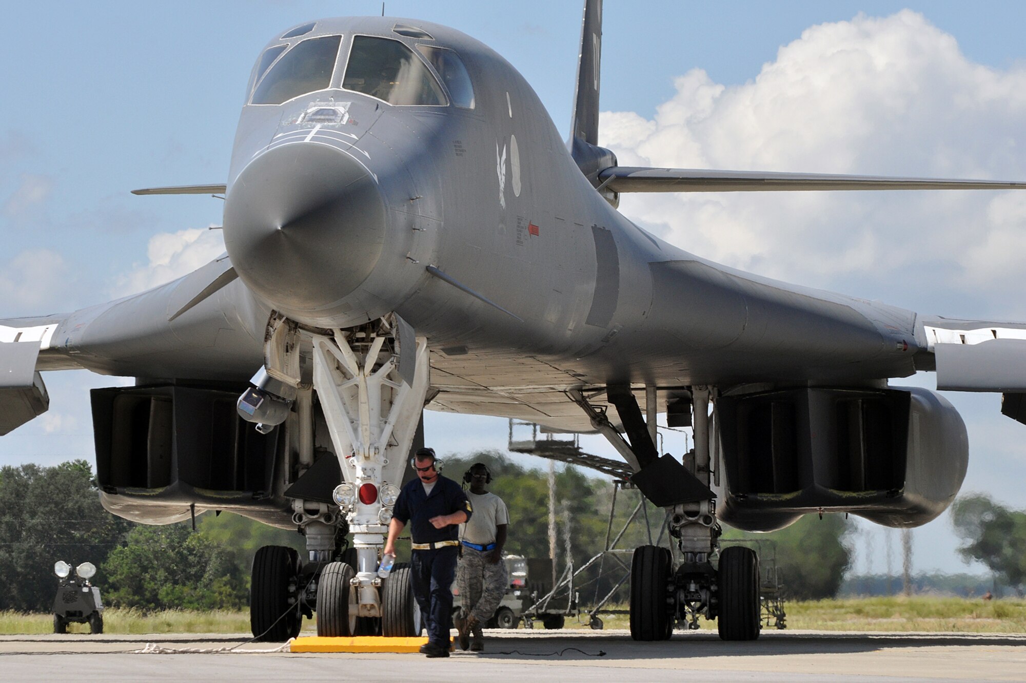EGLIN AIR FORCE BASE, Fla. -- Staff Sgt.(s) Dallas Osburn and Jerome Smith, 337th Test and Evaluation Squadron, wait for their B-1B Lancer to taxi for a test mission Sept. 24 here. Two B-1s were brought from Dyess Air Force Base, Texas, for test missions last week in an effort to better defend the aircraft for today’s warfighters and prove the strength of new software. The B-1 is a long range, multi-role, heavy bomber with a wingspan of 137 feet, and is capable of intercontinental flight unrefueled. (U.S. Air Force photo/ Airman Anthony Jennings)