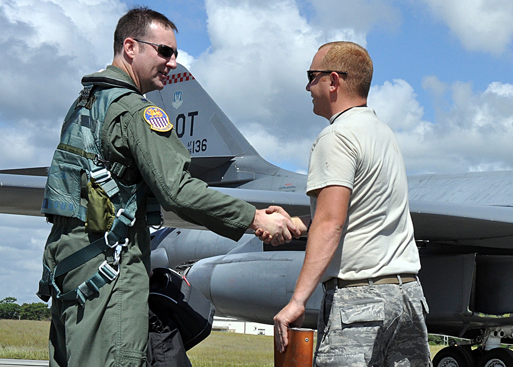 EGLIN AIR FORCE BASE, Fla. -- Lt. Col. David Kivioja, 53rd Test Management Group, shakes hands with Staff Sgt. Matthew Penrod, 337th Test and Evaluation Squadron, upon arriving at the B-1B Lancer for a test mission Sept. 24, here. Two B-1s were brought from Dyess Air Force Base, Texas, for test missions last week in an effort to better defend the aircraft for today’s warfighters and prove the strength of new software. The B-1 is a long range, multi-role, heavy bomber with a wingspan of 137 feet, and is capable of intercontinental flight unrefueled. (U.S. Air Force photo/ Airman Anthony Jennings)