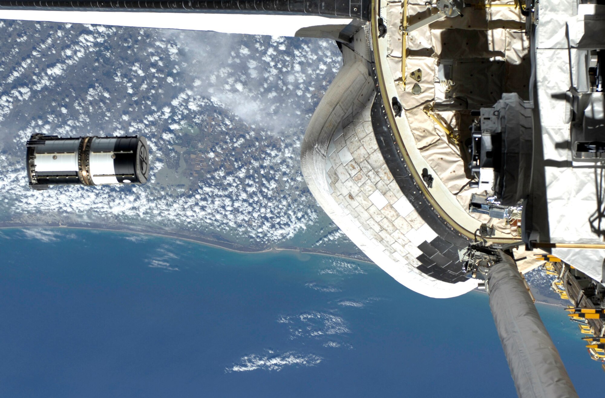 Atmospheric Neutral Density Experiment 2 is released from the Space Shuttle Discovery's payload bay by STS-127 crewmembers July 30, 2009. ANDE-2 consists of two spherical microsatellites, named Castor and Pollux, that will measure density and composition of the low-Earth orbit atmosphere while being tracked from the ground. The satellites' mission payload includes a plasma sensor called the Integrated Miniaturized Electrostatic Analyzer, which was developed by the U.S. Air Force Academy's Physics Department. (NASA photo)
