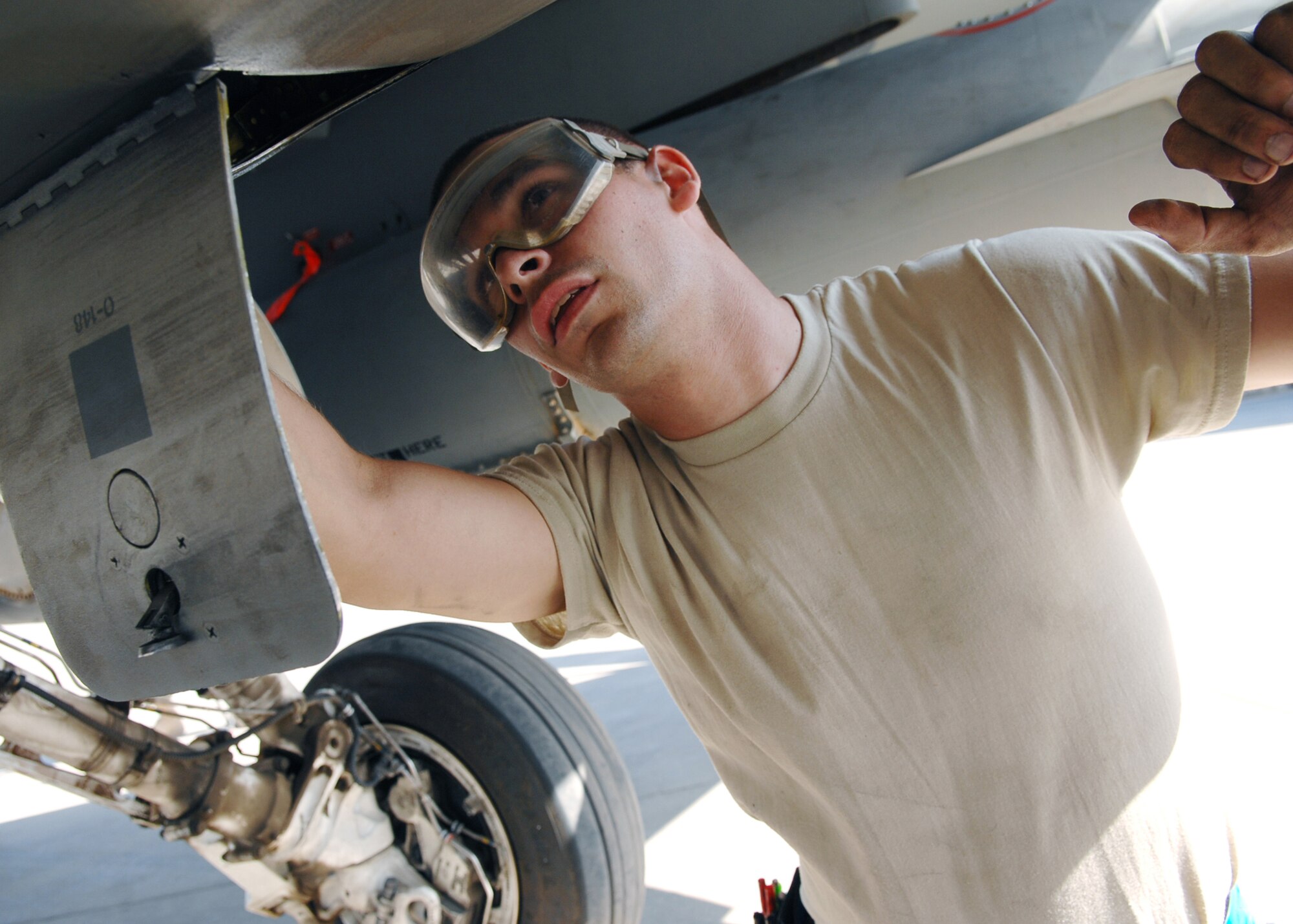 JOINT BASE BALAD, Iraq -- Airman 1st Class James Rouse, 332nd Expeditionary Aircraft Maintenance Squadron crew chief, checks the oil quality of an F-16 Fighting Falcon here Sept. 24. The 332nd EAMXS is responsible for aircraft launch and recovery and daily maintenance and refueling. Airman Rouse is deployed from Spangdahlem Air Base, Germany. (U.S. Air Force photo/Senior Airman Christopher Hubenthal)