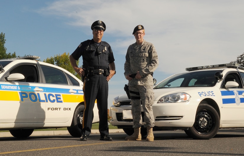 Randall Calderon Sr., Department of Defense Police patrolman at Fort Dix for
five years and retired Army first sergeant, and Airman 1st Class Alexander
McPeake, 87th Security Forces Squadron patrolman, are working together to
ensure the safety and security of Joint Base McGuire-Dix-Lakehurst. (U.S.
Air Force photo illustration/Staff Sgt. Danielle Johnson)
