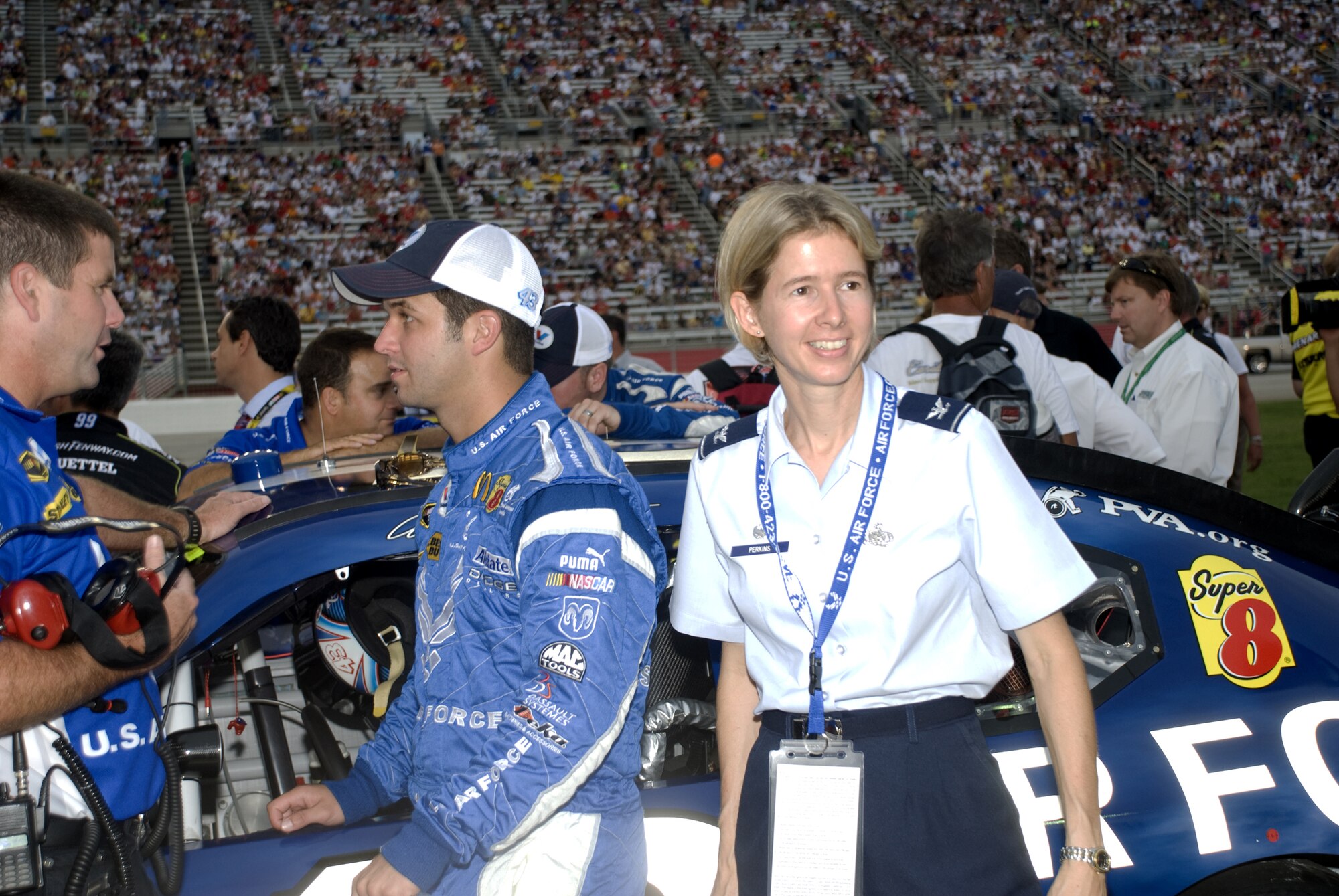 Col. Lee-Ann Perkins, 78th Mission Support Group commander, stands next to NASCAR driver Reed Sorenson at the Pep Boys Auto 500 at the Atlanta Motor Speedway. Colonel Perkins represented the Air Force at the race. Courtesy photo