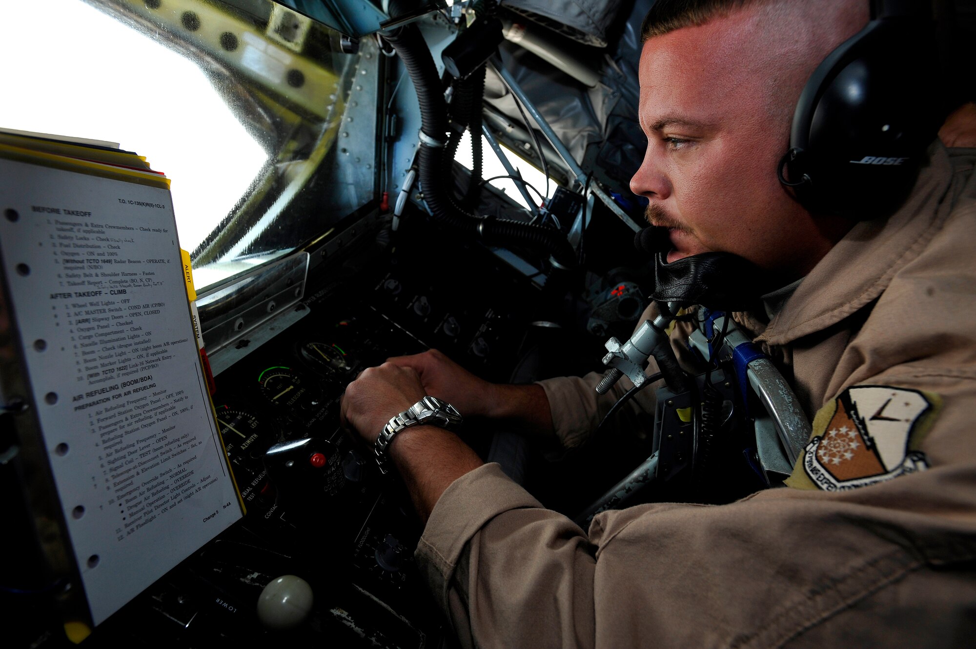 U.S. Air Force Master Sgt. Nathan Neidhardt, 340th Expeditionary Air Refueling Squadron boom operator, deployed to a base in Southwest Asia completes his check list before refueling an aircraft here Sept. 25. The KC-135 Stratotanker will refuel various aircraft over Afghanistan in support of Operation Enduring Freedom. (US Air Force photo by Staff Sgt. Angelita Lawrence)(released)
