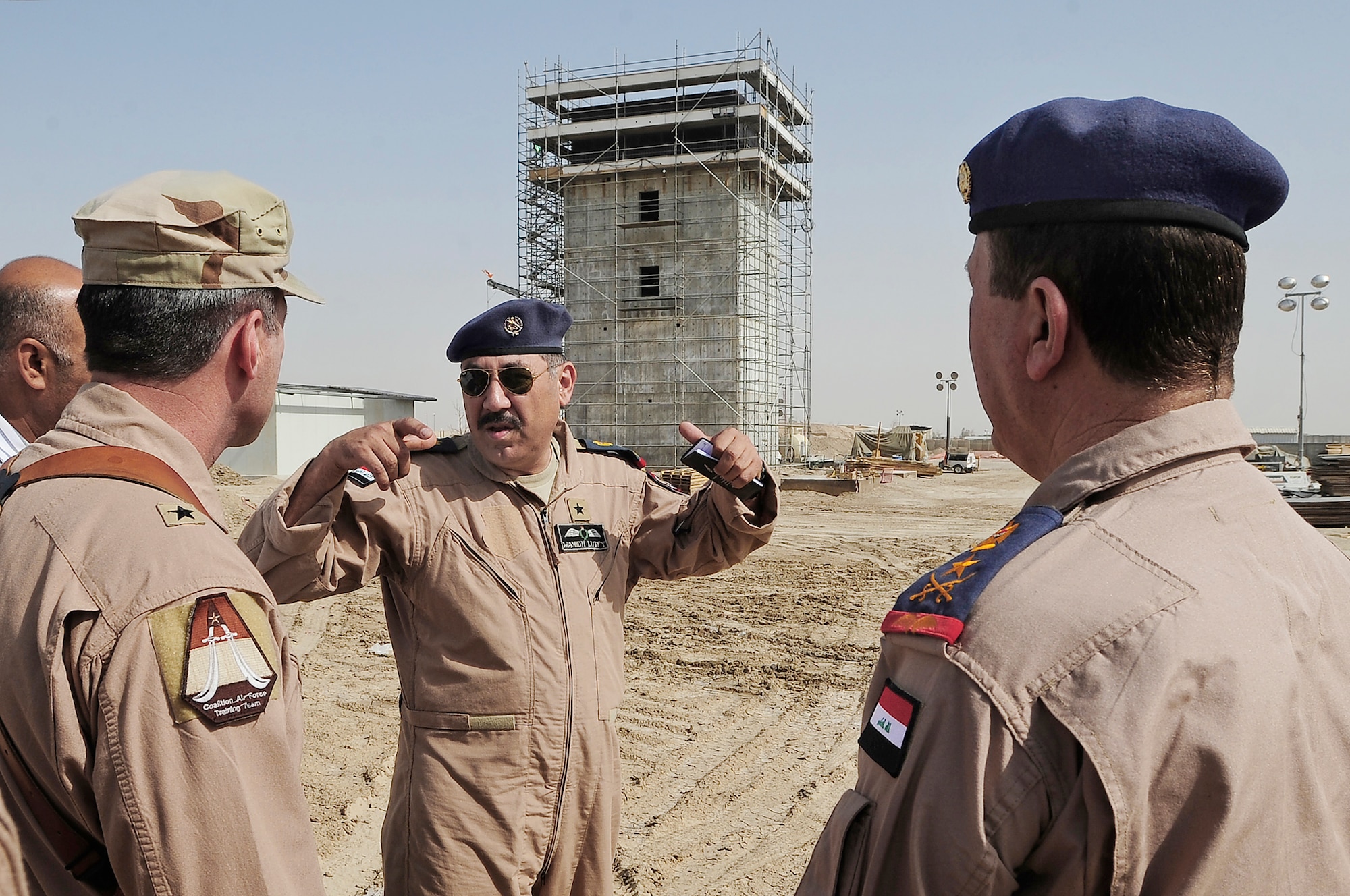 Maj. Gen. Robert Kane (left),  Iraqi air force Staff Brig. Gen. Wamidh and Iraqi air force Commander Staff Lt. Gen. Anwar Hamad Amen Ahmed discuss the on-going construction of the new air traffic control tower Sept. 24, 2009, at Ali Base, Iraq. General Kane is the director, Iraq Training and Advisory Mission - Air Force, and General Wamidh is the Iraqi air force operations commander.(U.S. Air Force photo/Senior Airman Tony R. Ritter) 