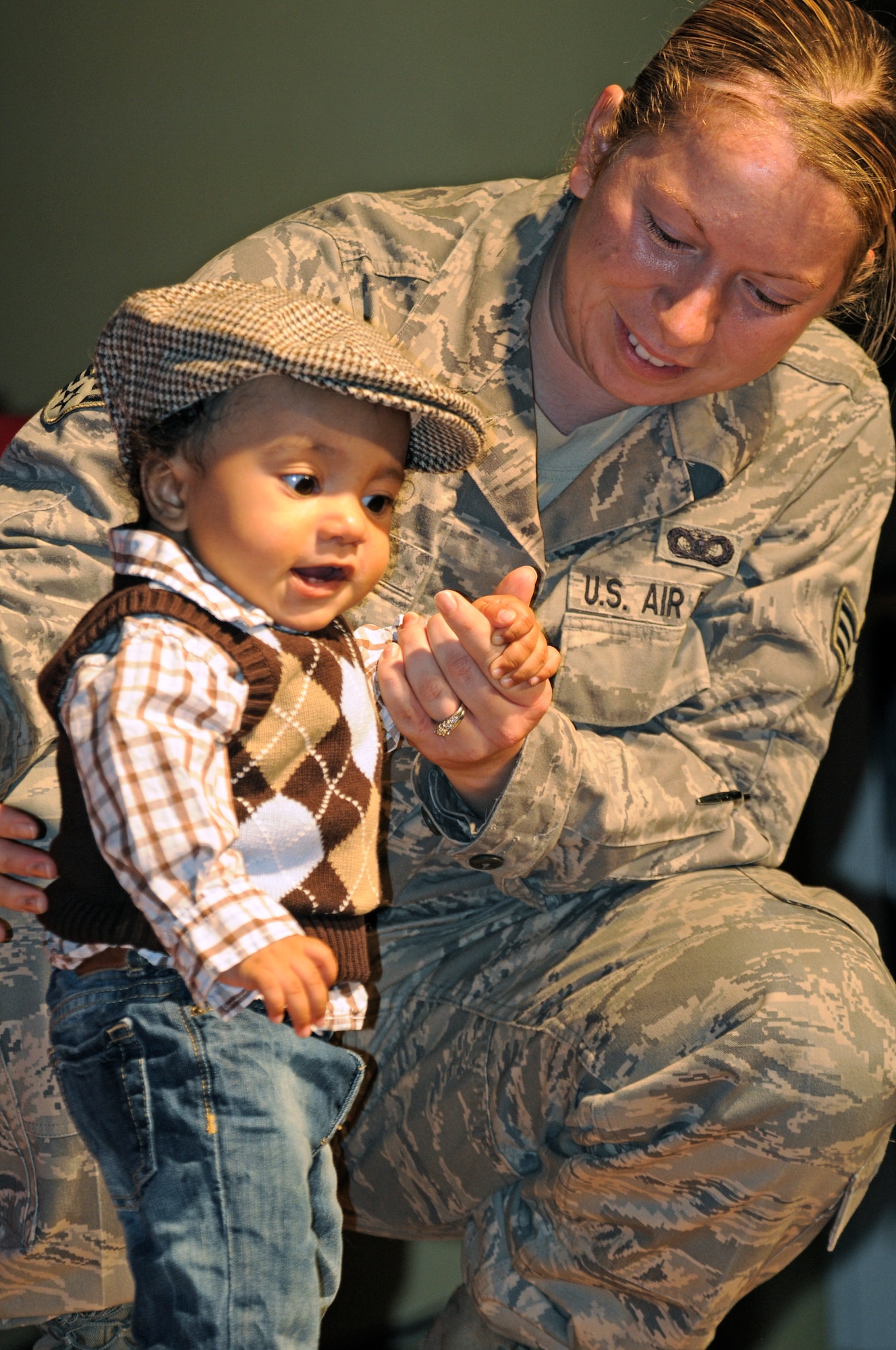 SPANGDAHLEM AIR BASE, Germany – Senior Airman Heather Craft helps her 5-month-old baby, Isaiah, pose on stage during the “Cutest Little Baby” competition held at the Brick House Sept. 26. Isaiah won the newborn to 6-month-old category with 15 out of 43 votes. All 22 babies participating in the event received a gift basket, and the winners of each of the four categories received a $75 gift certificate from the Army and Air Force Exchange Services. (U.S. Air Force photo/Senior Airman Benjamin Wilson)