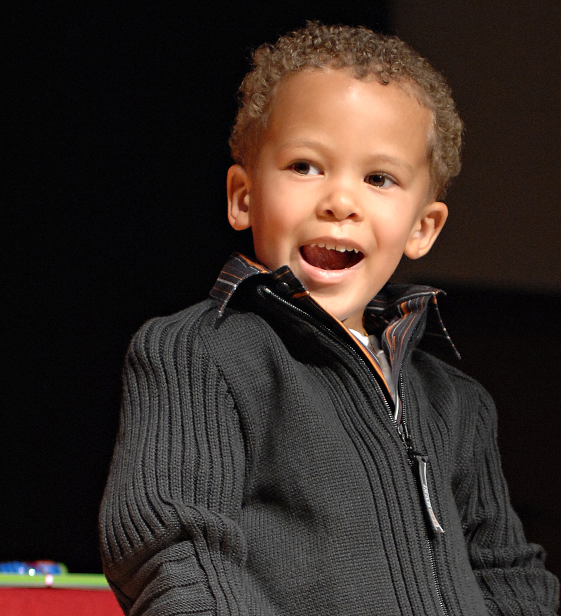 SPANGDAHLEM AIR BASE, Germany – Demetrius Hunt, 3, son of Tech. Sgt. Amber Hunt, poses on stage during the “Cutest Little Baby” competition held at the Brick House Sept. 26. Demetrius won the 2-year, 2-month-old to 3-year, 11-month-old category with 25 out of 43 votes. All 22 babies participating in the event received a gift basket, and the winners of each of the four categories received a $75 gift certificate from the Army and Air Force Exchange Services. (U.S. Air Force photo/Senior Airman Benjamin Wilson)