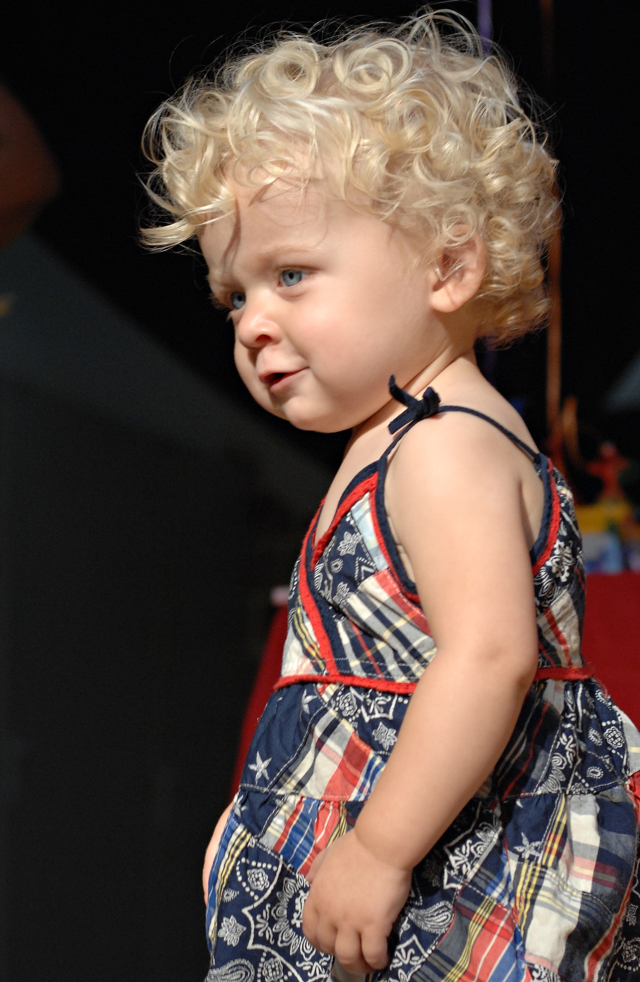 SPANGDAHLEM AIR BASE, Germany – Sixteen-month-old Reese Crandall, daughter of Senior Airman Nathan Crandall, poses on stage at the cutest baby competition held at the Brick House Sept. 26. Reese won the 13 to 26-month-old category with 14 out of 42 votes. All 22 babies participating in the event received a gift basket, and the winners of each of the four categories received a $75 gift certificate from the Army and Air Force Exchange Services. (U.S. Air Force photo/Senior Airman Benjamin Wilson)